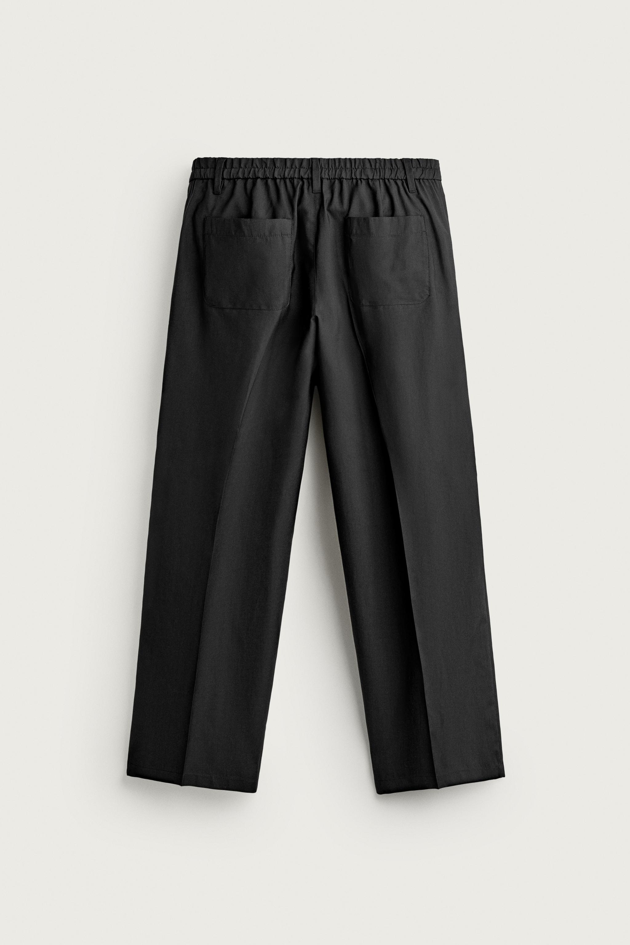 PLEATED FLOWY TROUSERS