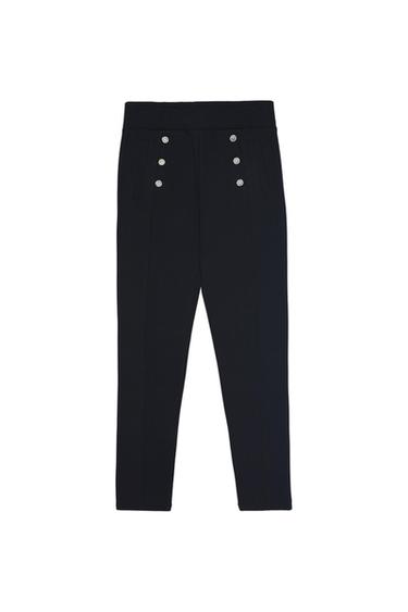 Black trousers featuring a six-silver-button detail on the front and vertical stitching, on a white background.