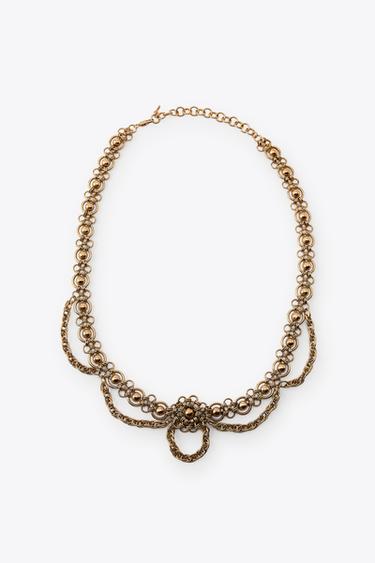 CINTURÓN METÁLICO FLORES - oro rosa de Zara