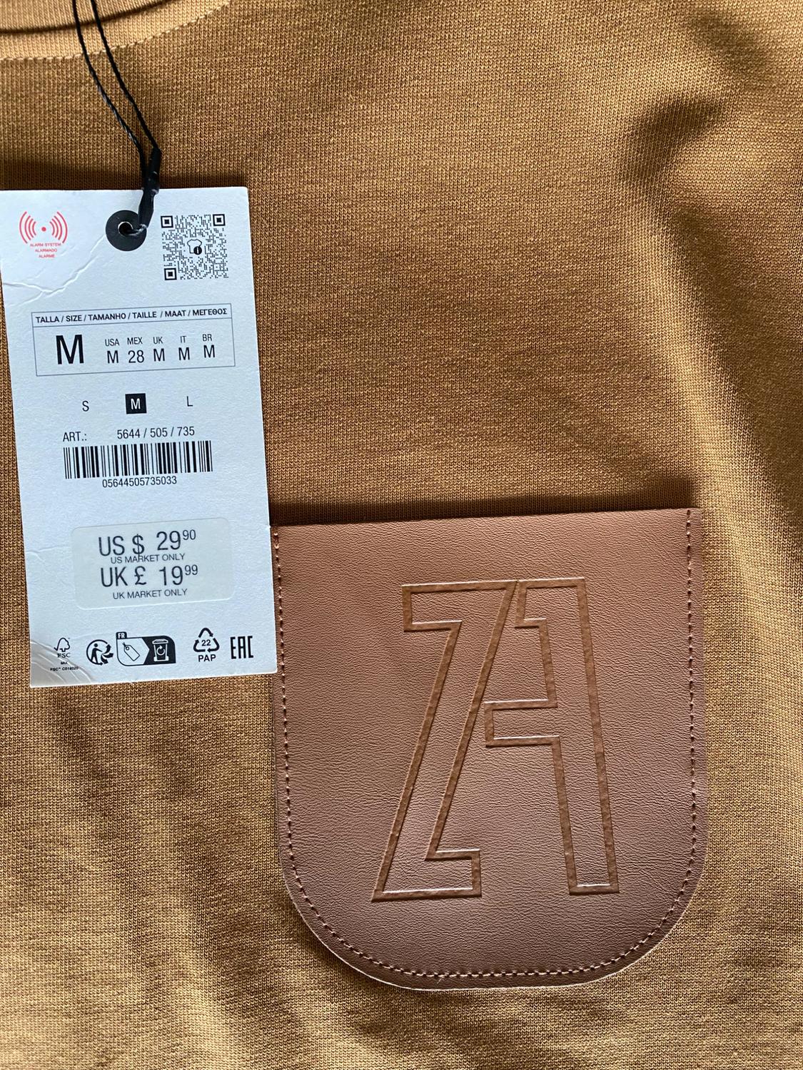 TOP WITH PADDED SHOULDERS AND LABEL - Image 3