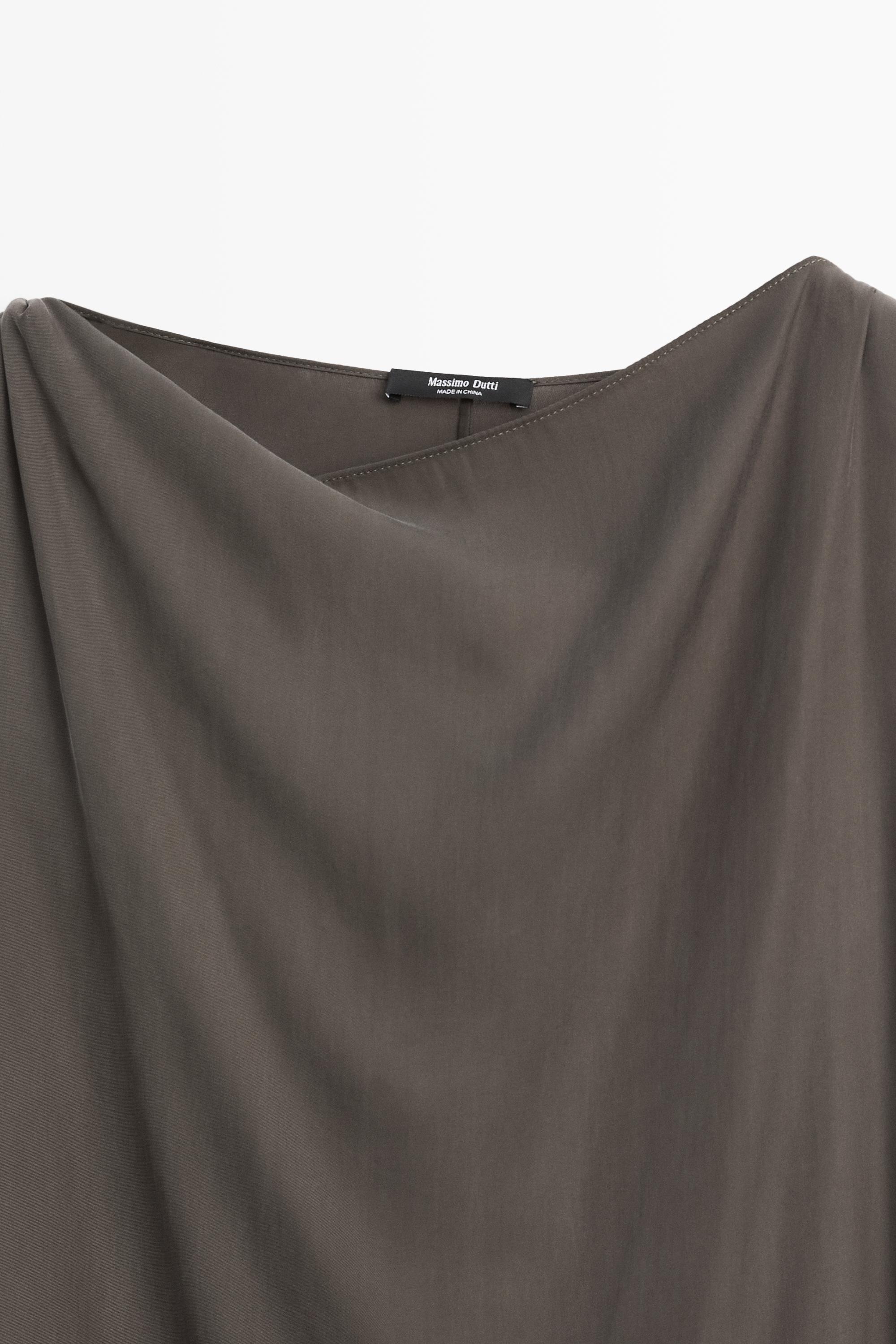 Asymmetric flowing cape top