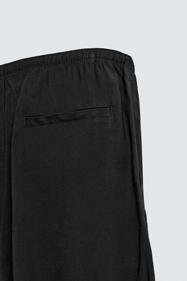 RELAXED FIT FLOWING TROUSERS - Black by Zara - Image 9