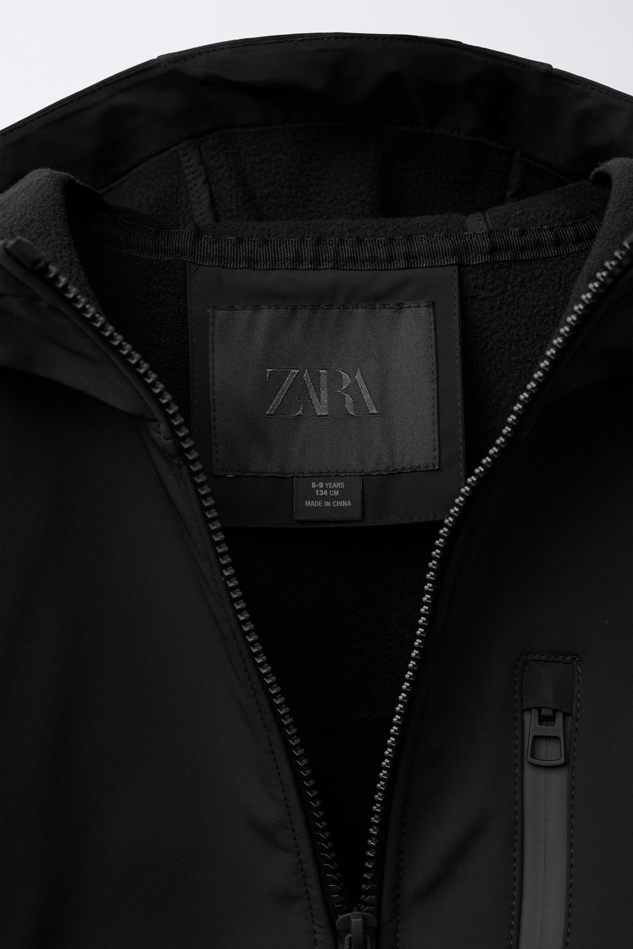 VESTE TECHNIQUE DOUBLÉE CAPUCHE DÉPERLANTE
