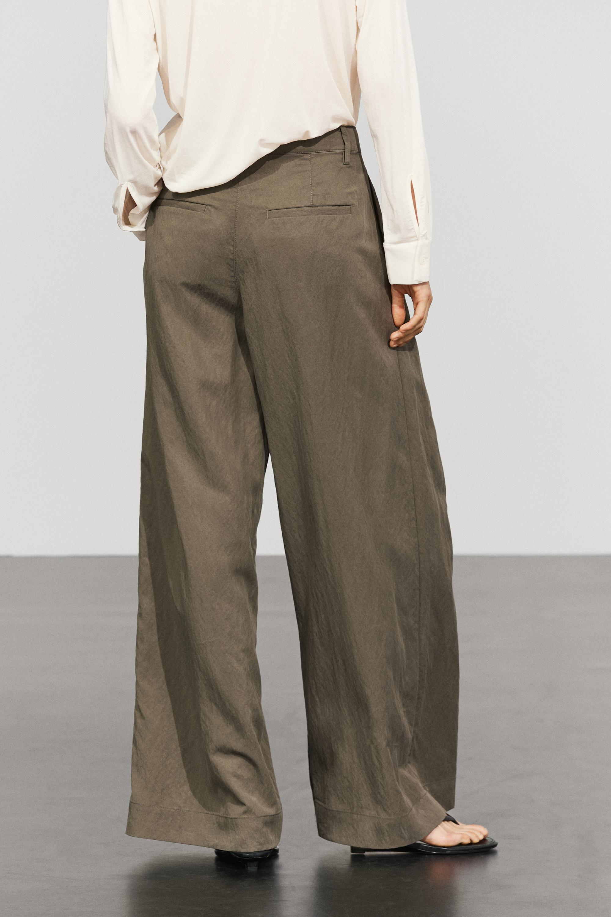 Technical wide-leg pleated pants