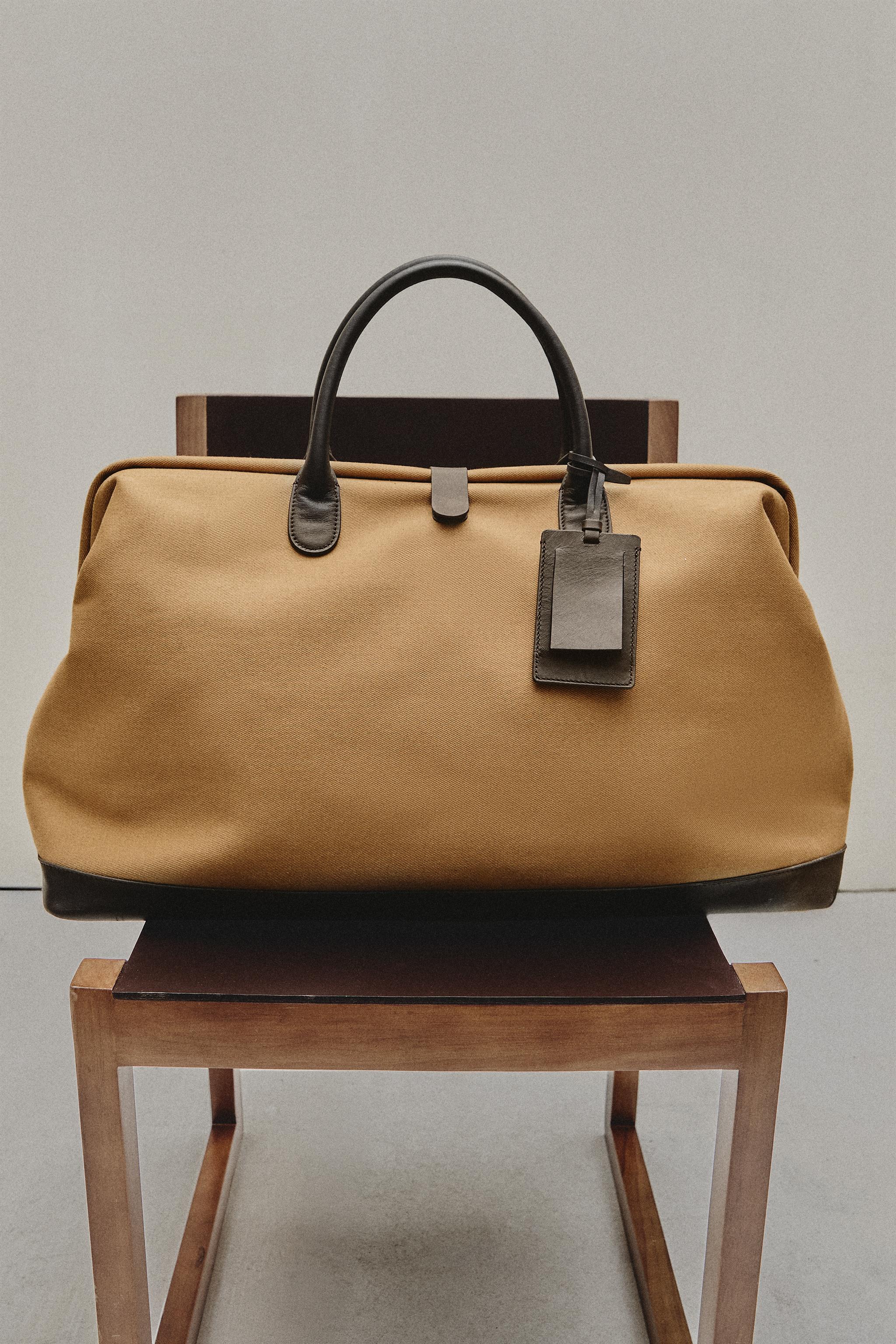 COTTON TRAVEL BAG WITH BUTTON CLOSURE