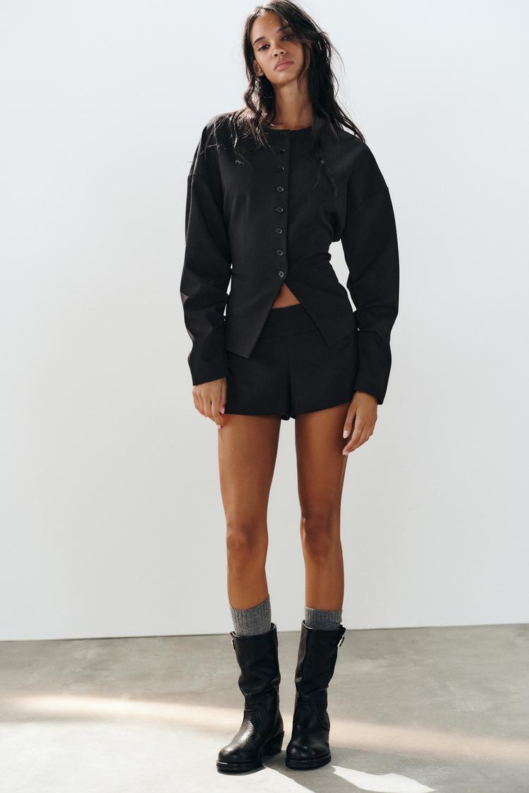 Blazer botones pliegues manga