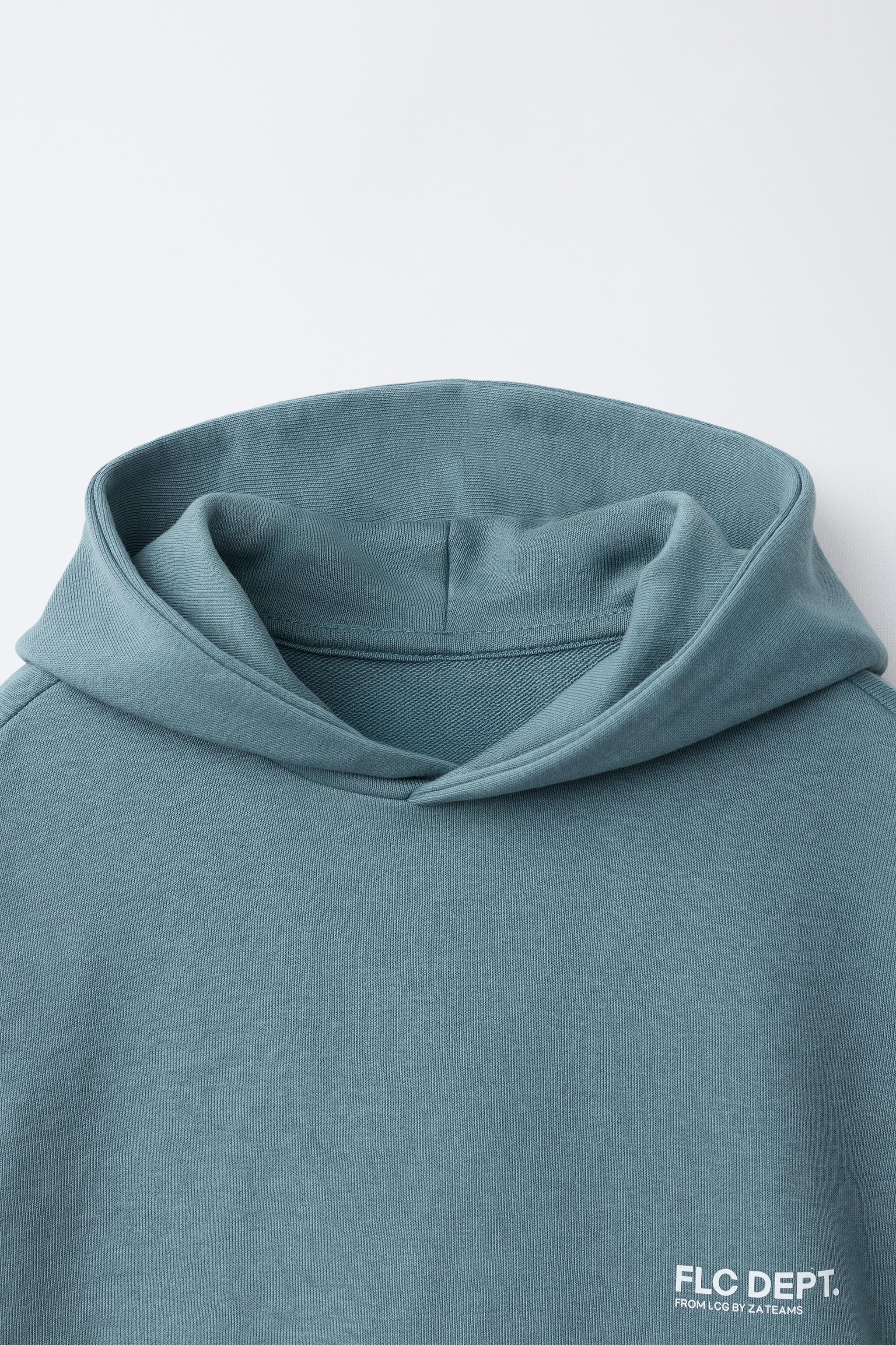 GILET À CAPUCHE EN MOLLETON IMPRIMÉ