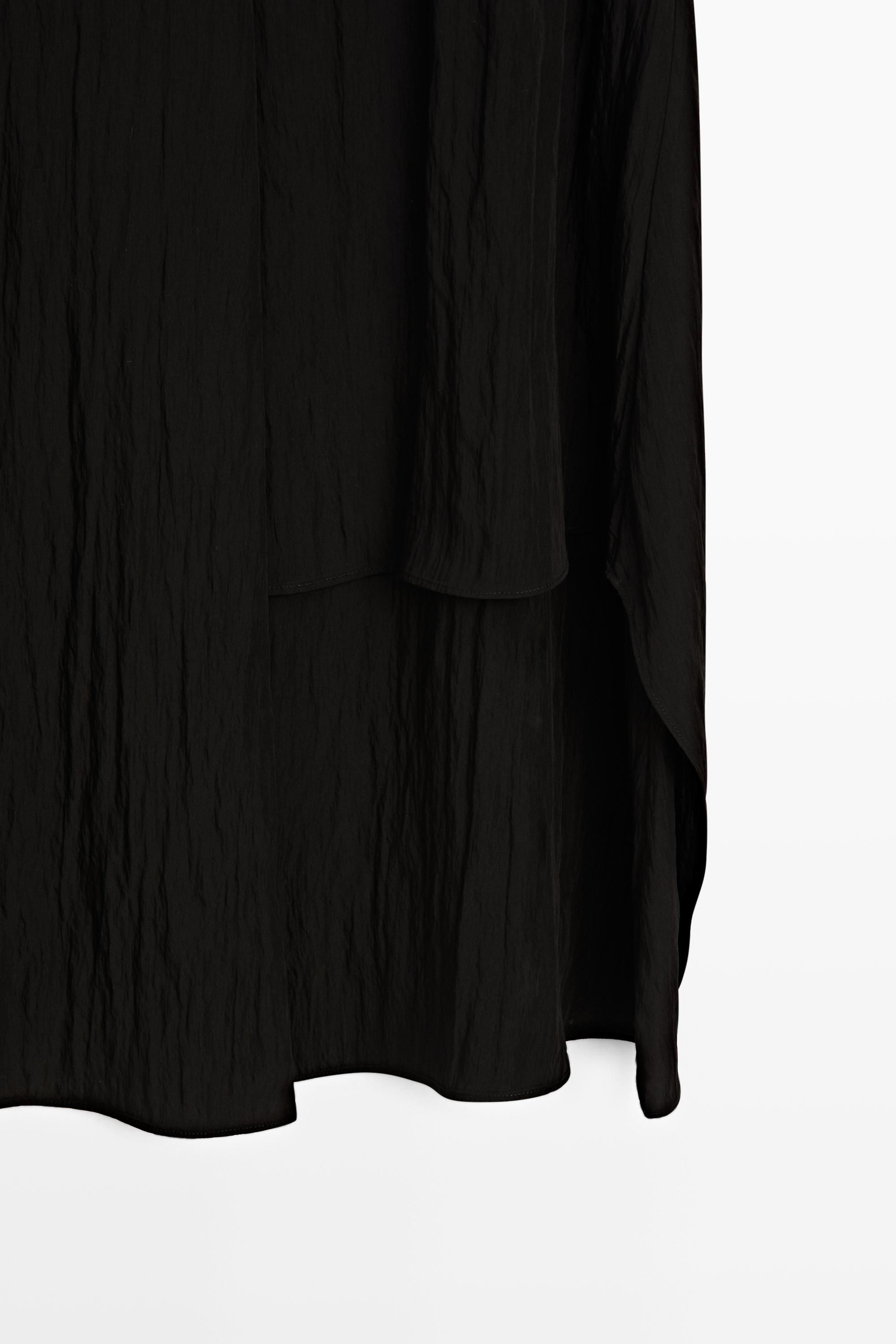 Jupe midi fluide à panneaux asymétriques