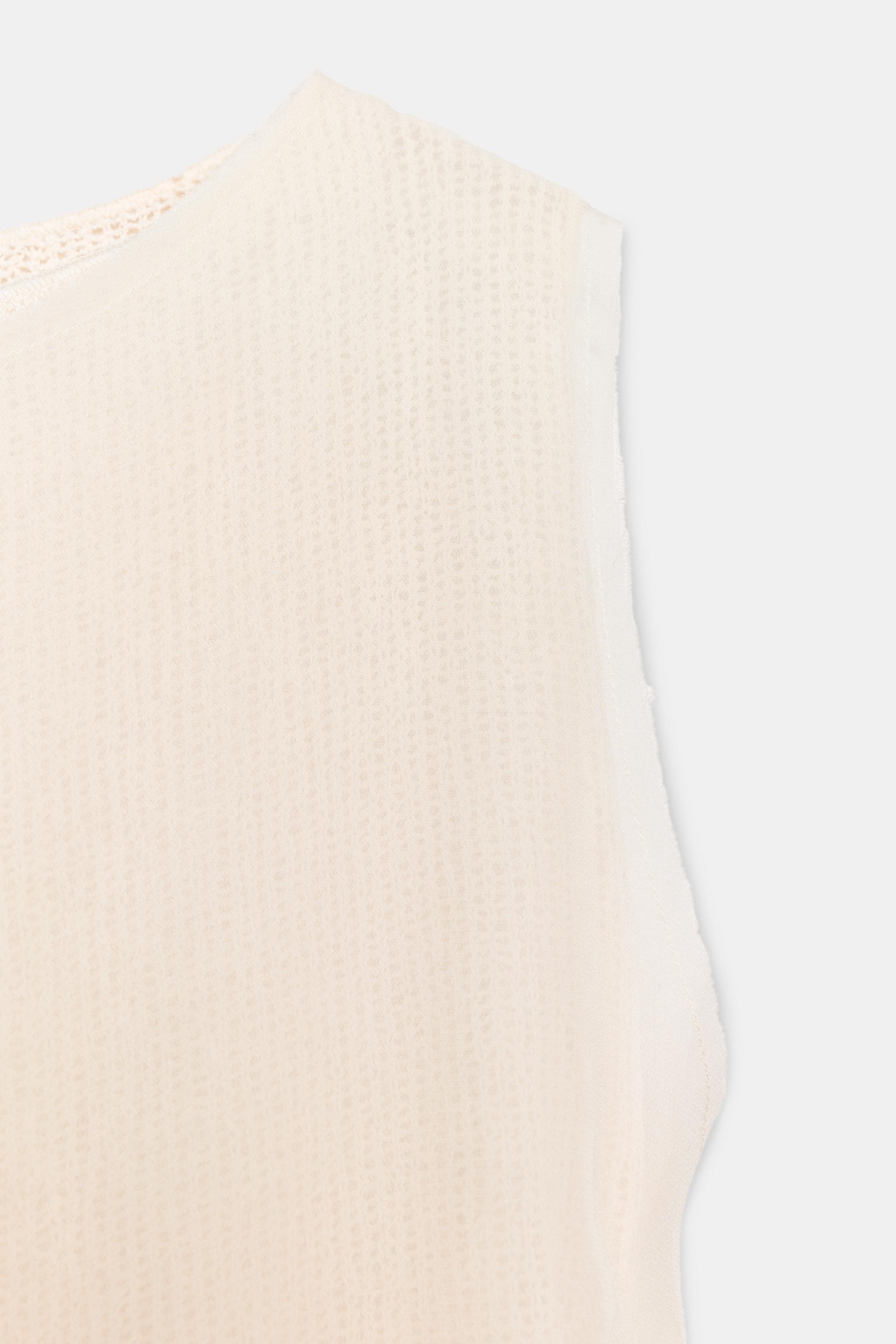 TOP ASYMÉTRIQUE SANS MANCHES