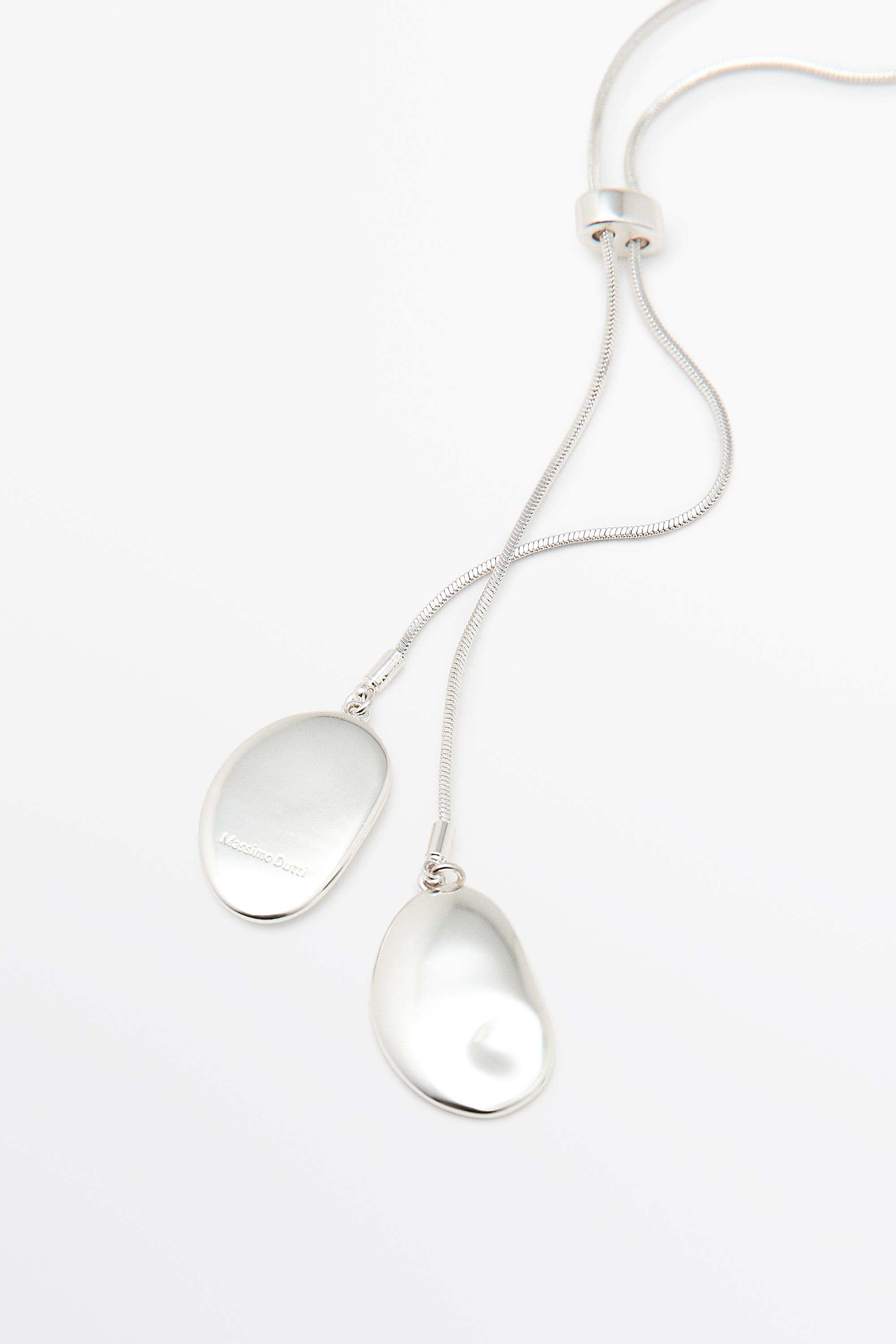Collier cravate pièces métalliques