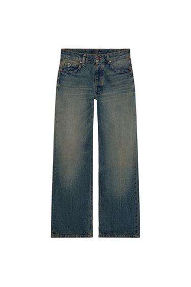 Front view of mid-rise, straight-leg, five-pocket indigo jeans. Front button fastening.