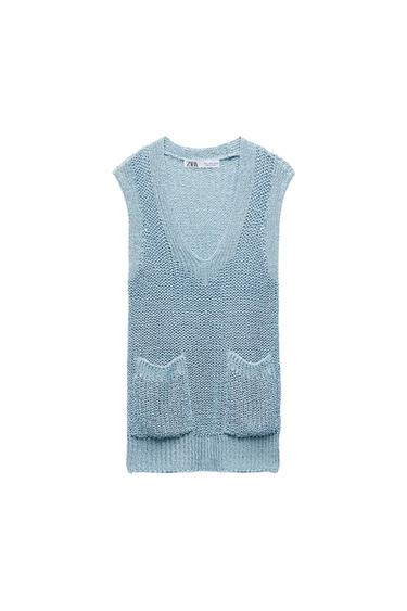 Light blue knitted vest, V-neck and two front pockets on a white background. Label with ZARA text.