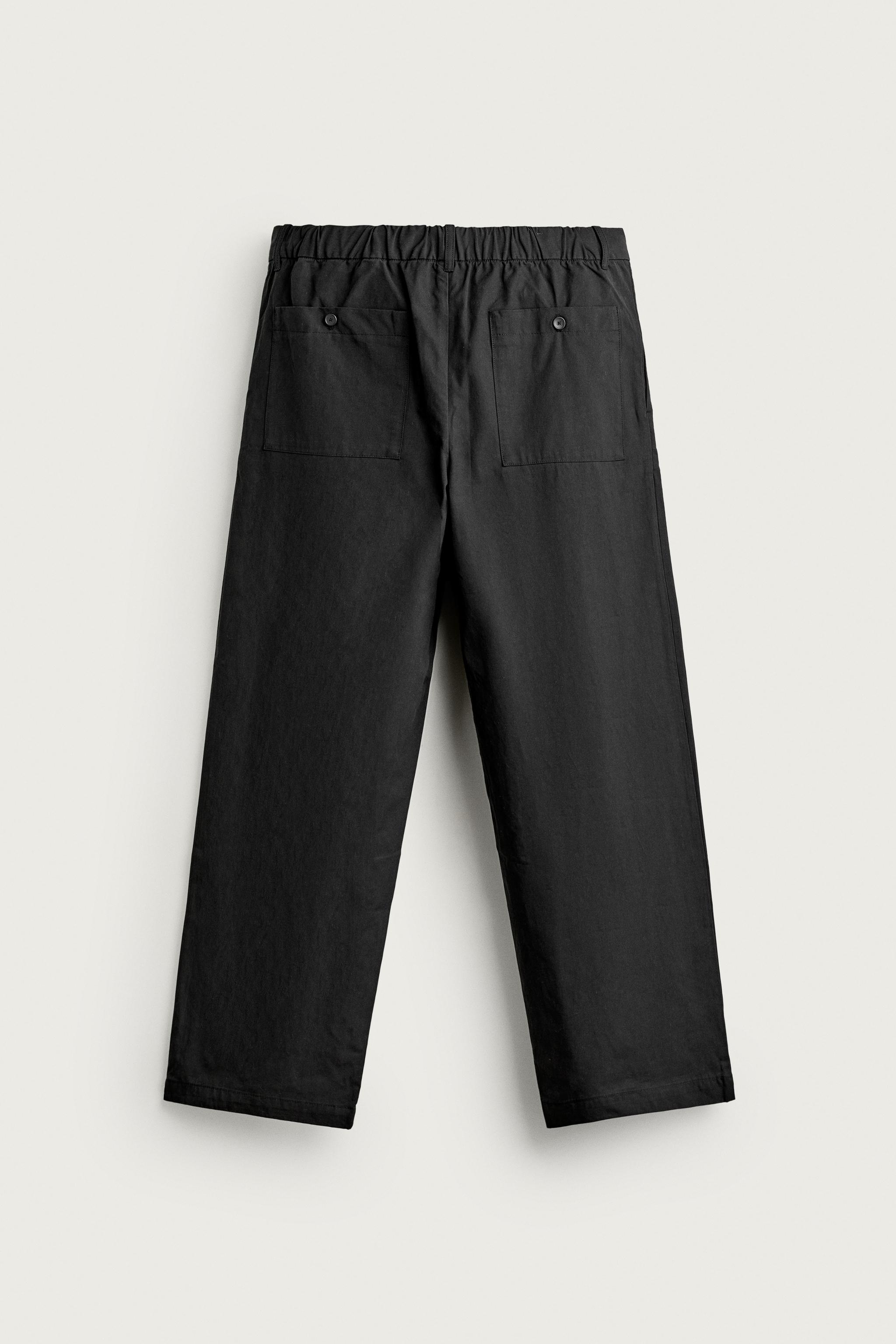 STRAIGHT-FIT PANTS WITH SIDE PLEATS