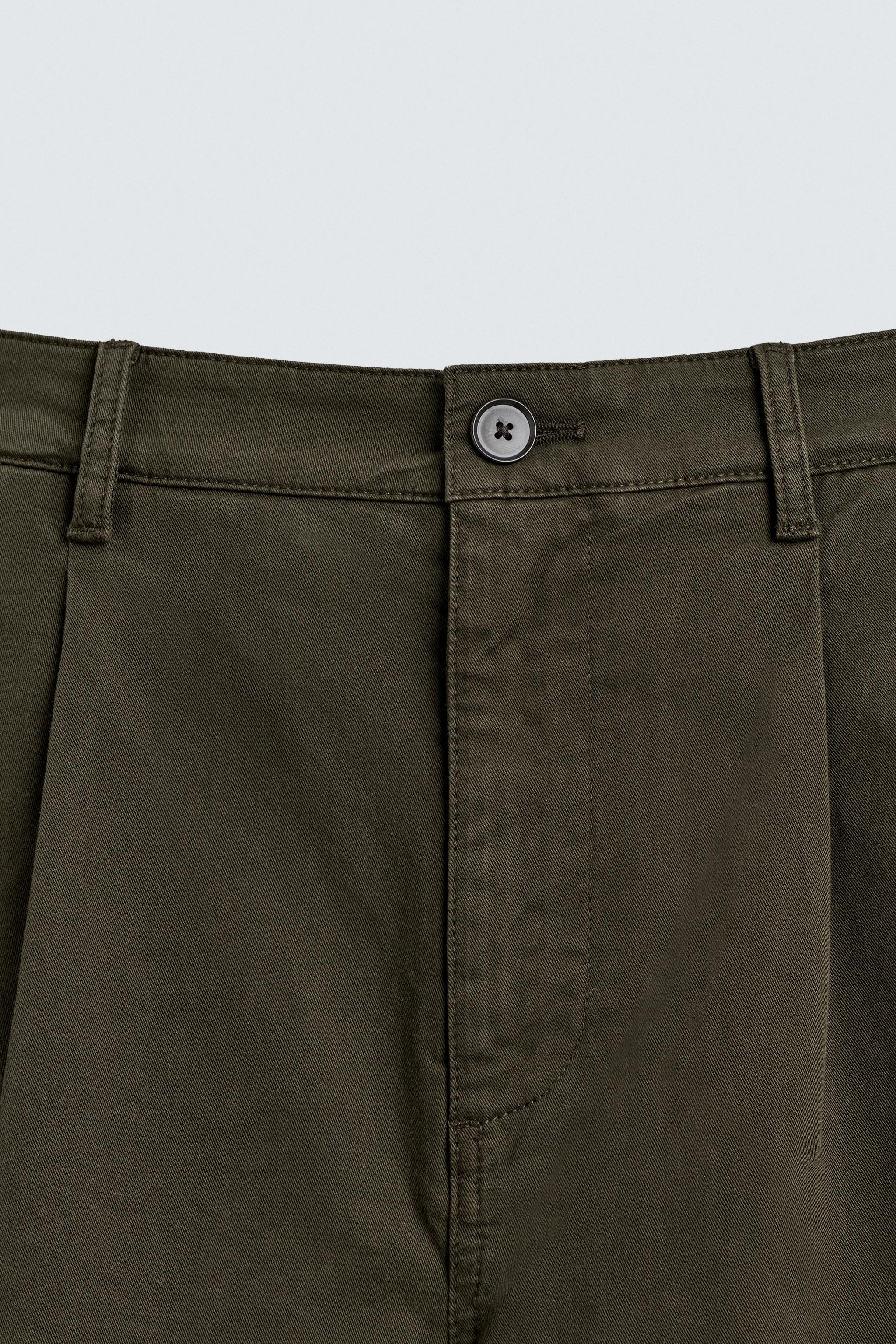 PLEATED CHINO PANTS