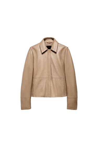 Front view of a stone-coloured fitted blazer with a lapel collar, long sleeves, and concealed side pockets. Concealed front fastening.