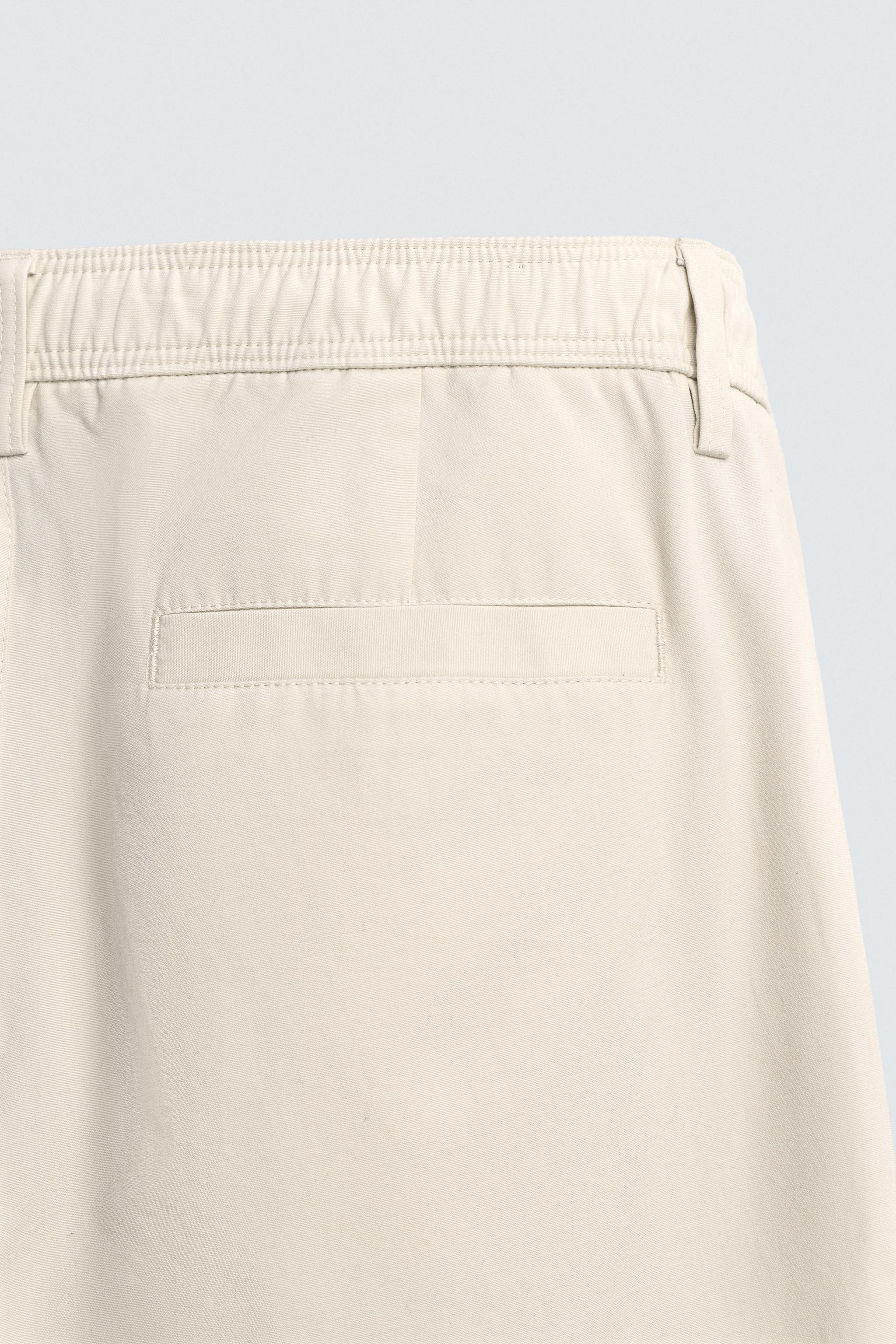 PLEATED STRAIGHT FIT PANTS