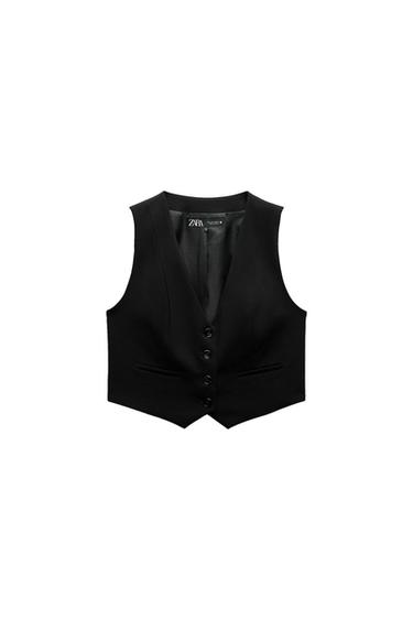 Sleeveless black vest with front buttons and faux pockets. Visible inner label with text "ZARA". White background.
