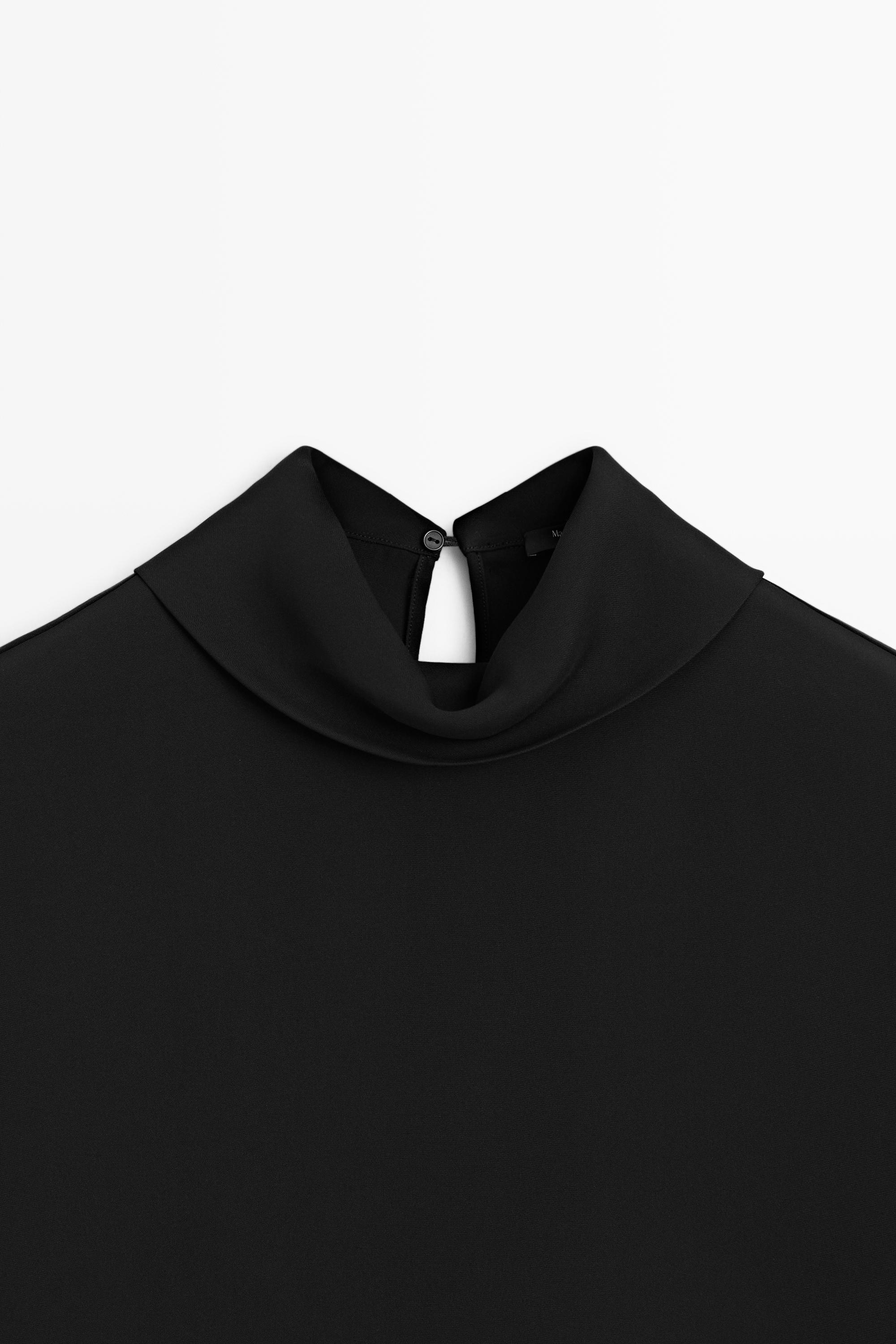 Top col roulé emmanchures larges