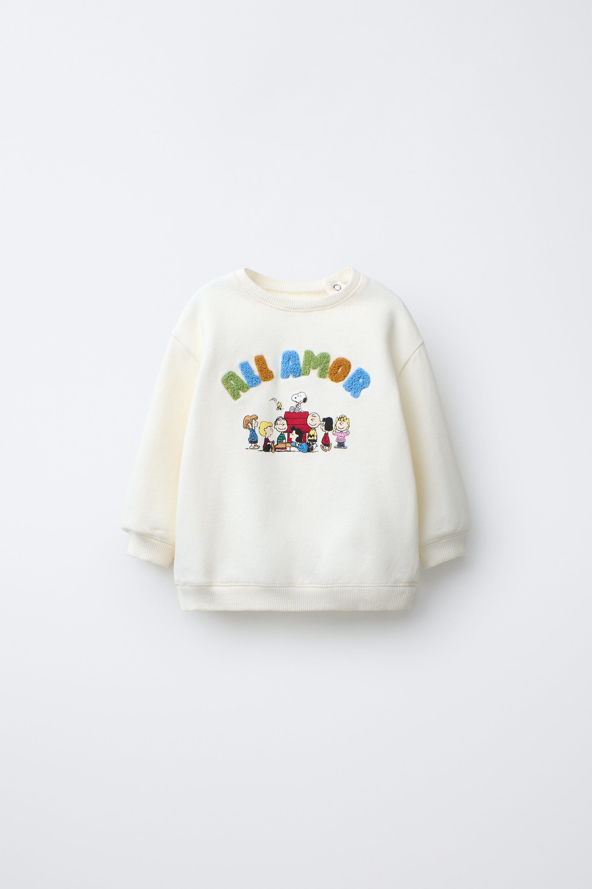SWEAT AVEC PIÈCE VELOURS BOUCLÉ SNOOPY PEANUTS™