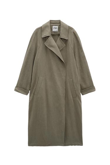 Olive green, straight-cut long coat with lapels, pockets and turned-up sleeves on a white background. ZARA label on the collar.