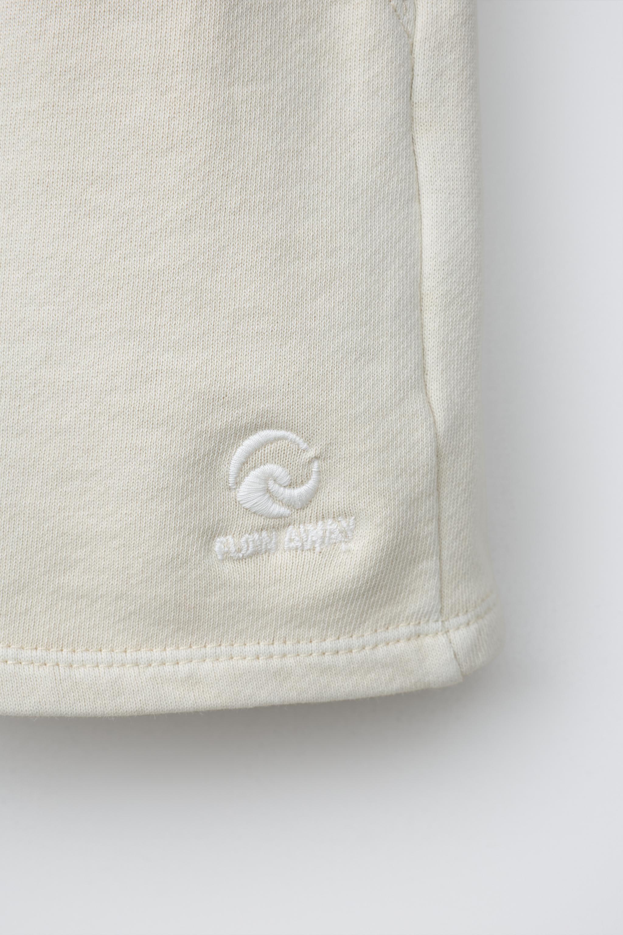 EMBROIDERED GARMENT DYED PLUSH SHORTS