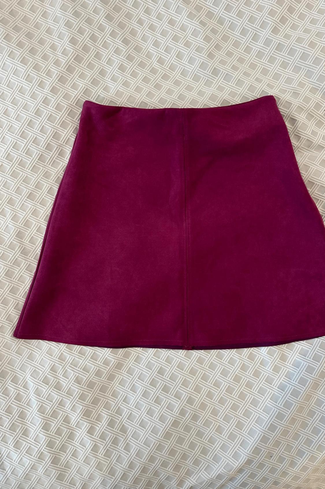 Front view of a short magenta skirt.