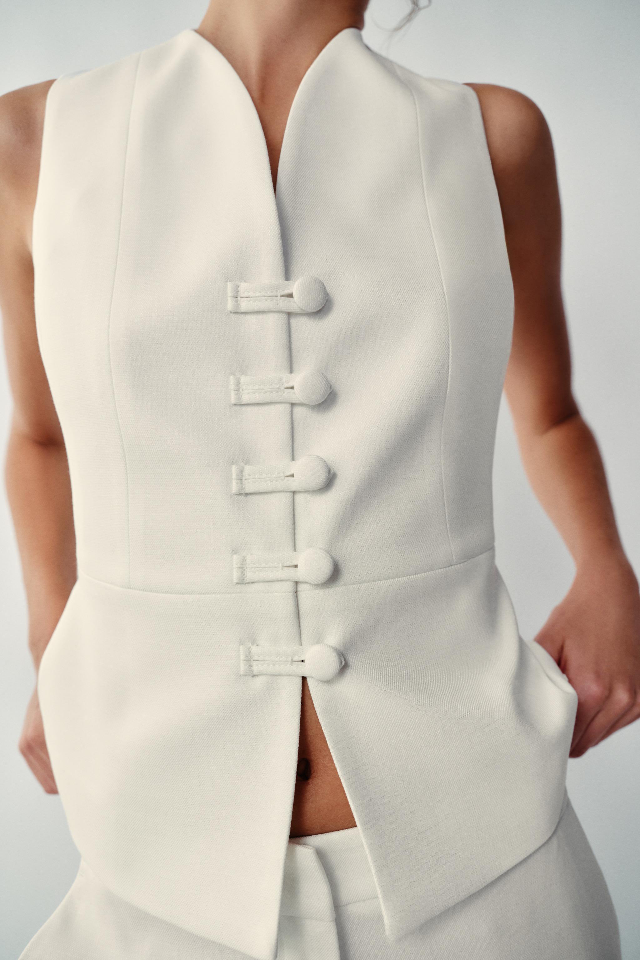 PEPLUM VEST