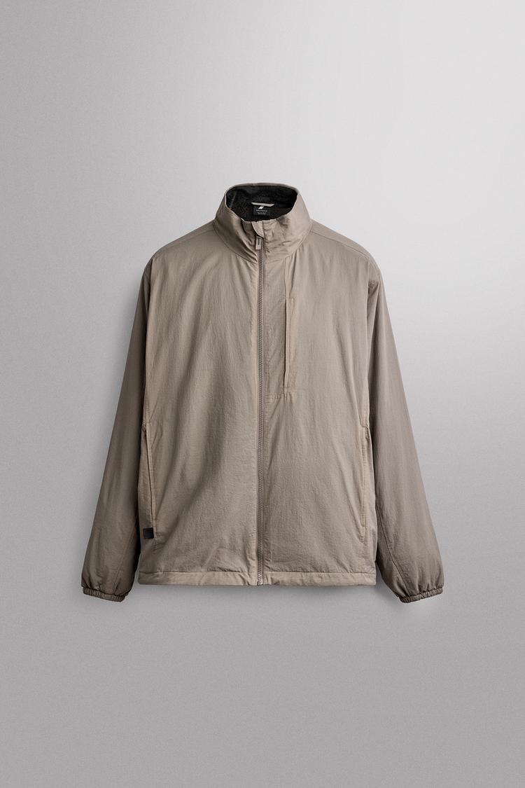 TECHNICAL JACKET WITH FLEECE LINING