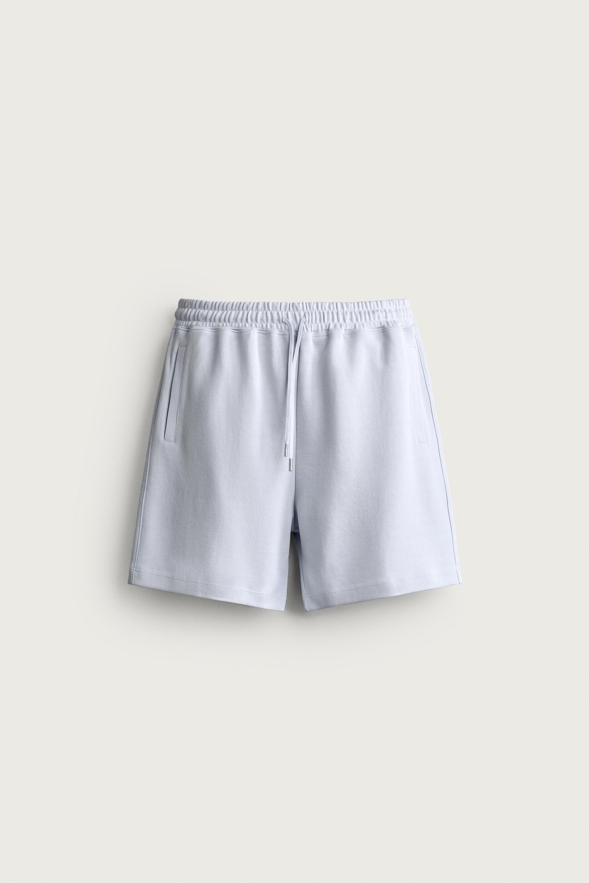 RELAXED FIT INTERLOCK TRACK SHORTS — Sky blue