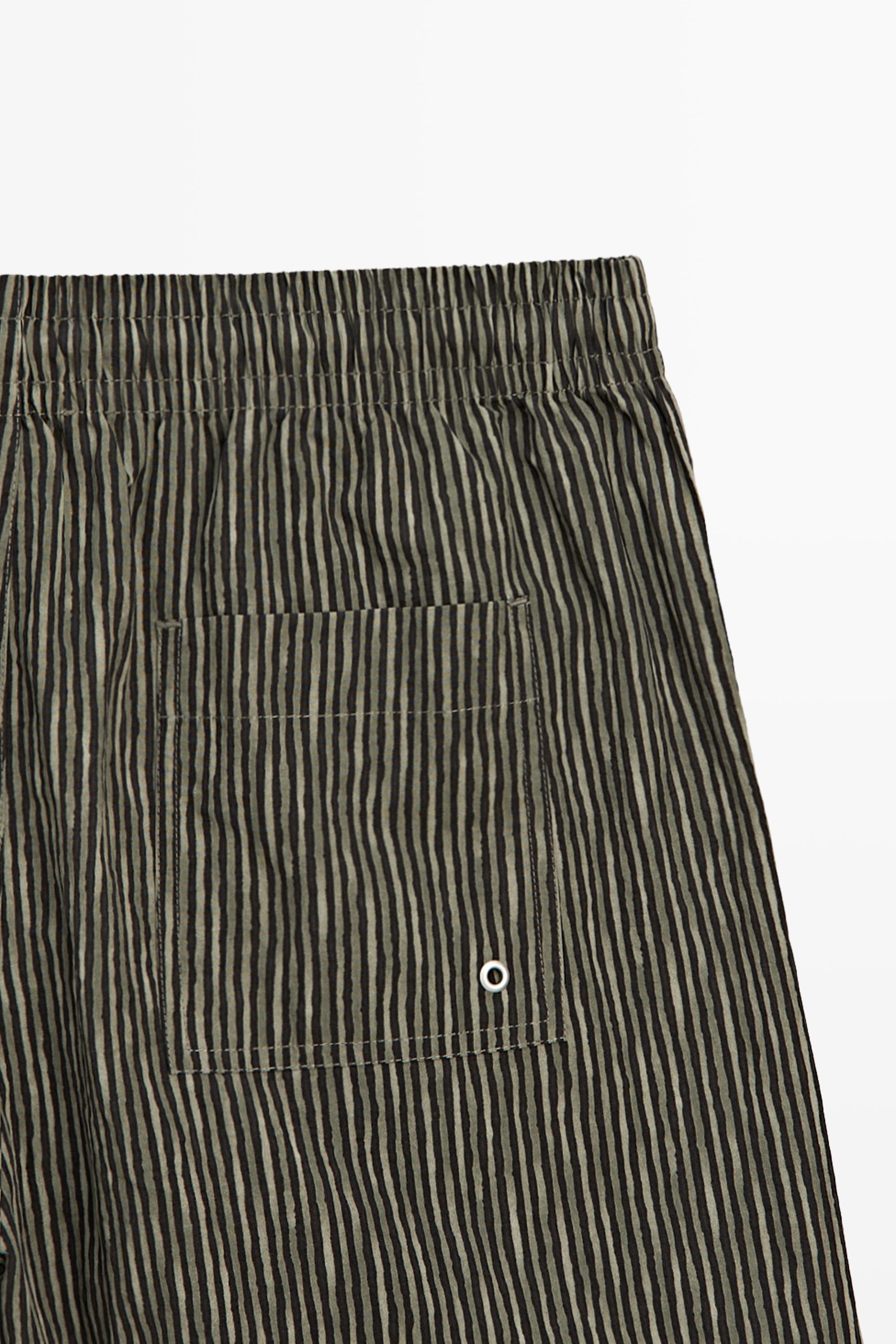 Striped print swimming trunks