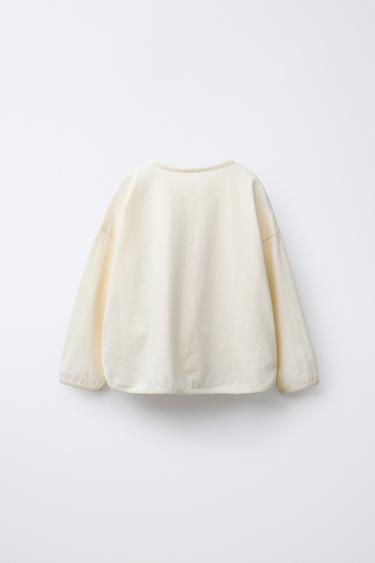 T-SHIRT AVEC INSCRIPTION ET PIÈCES - Écru de Zara - Image 1