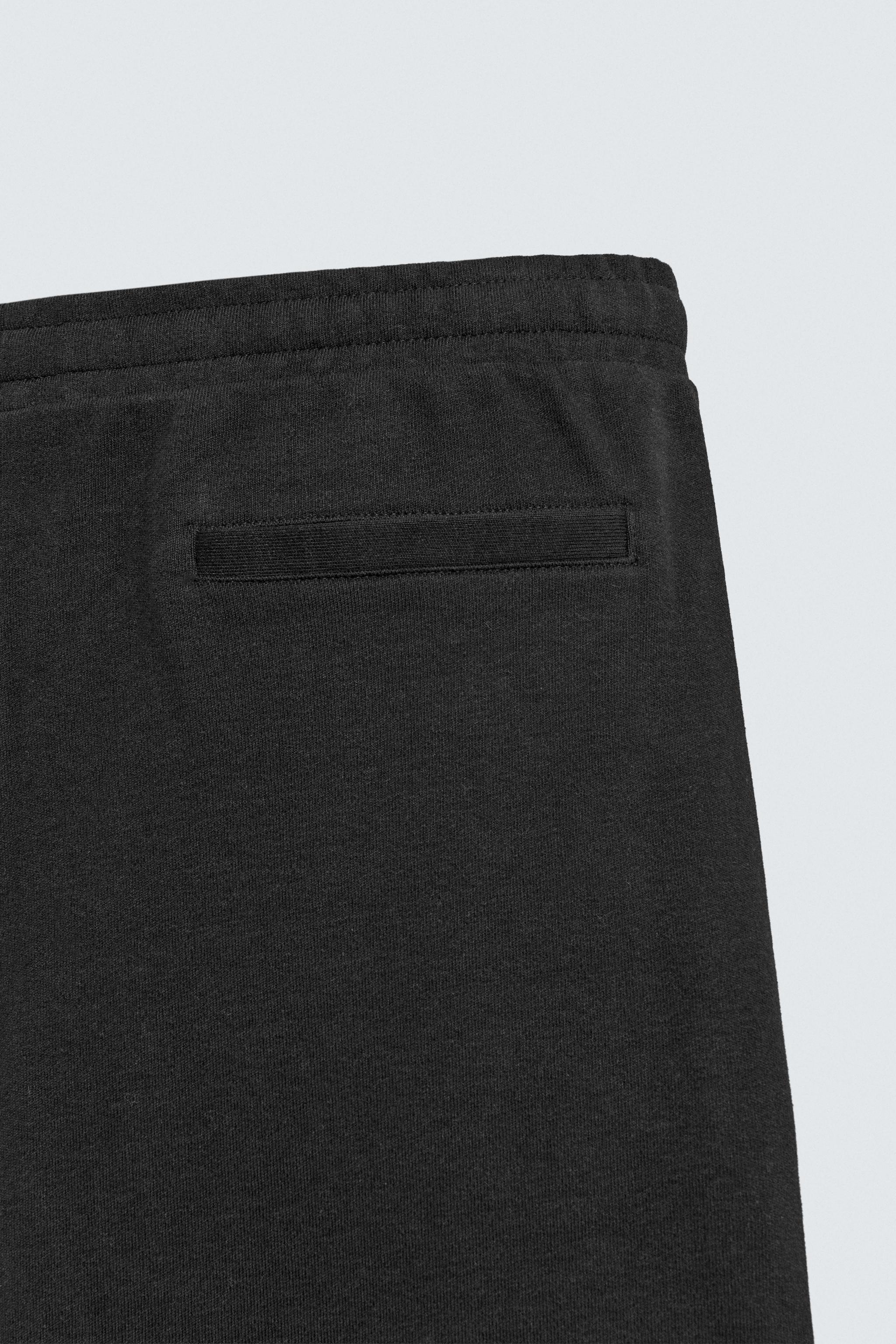 PLEATED WIDE FIT JOGGER PANTS