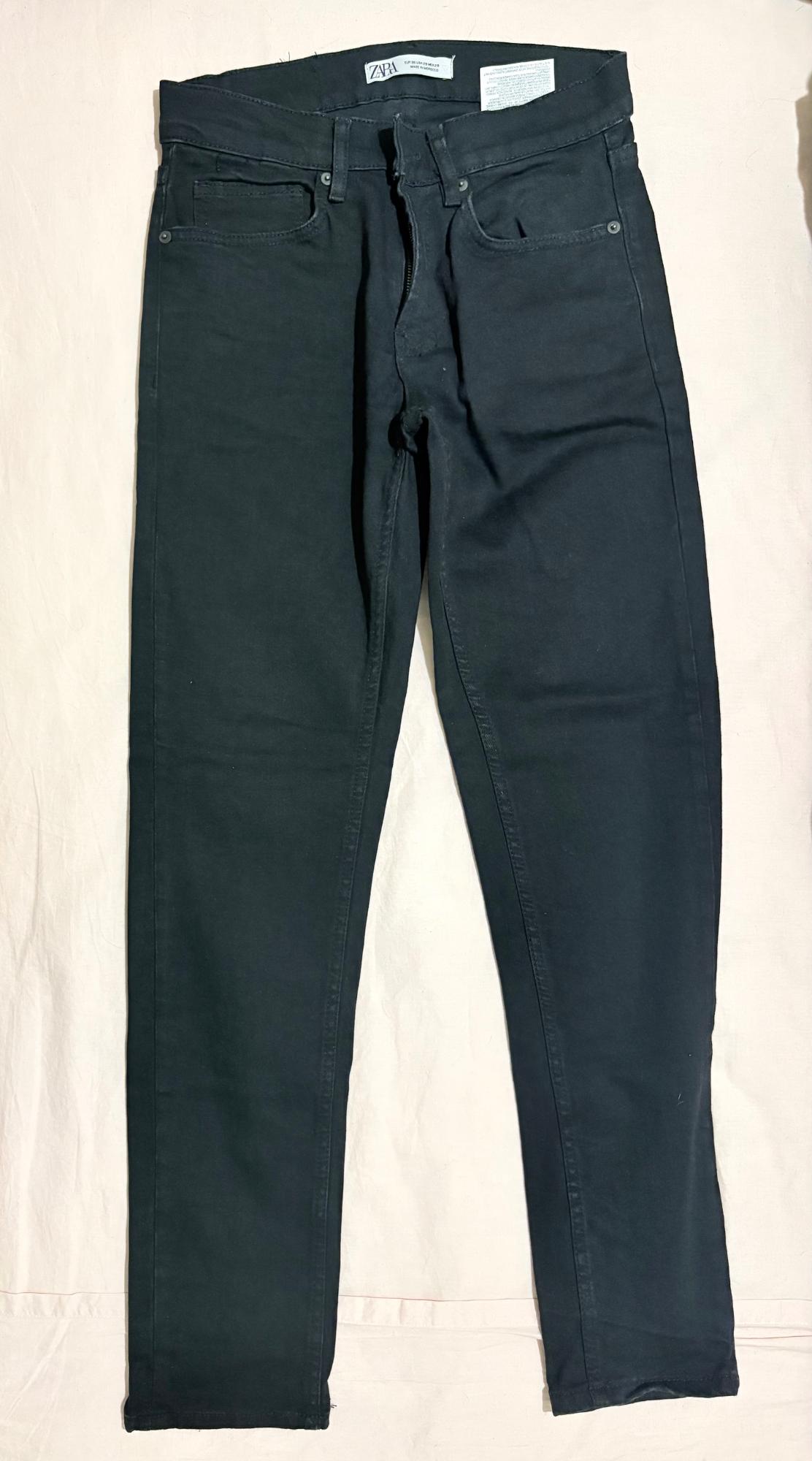 Black jeans on a light background. The inner label reads ZARA.