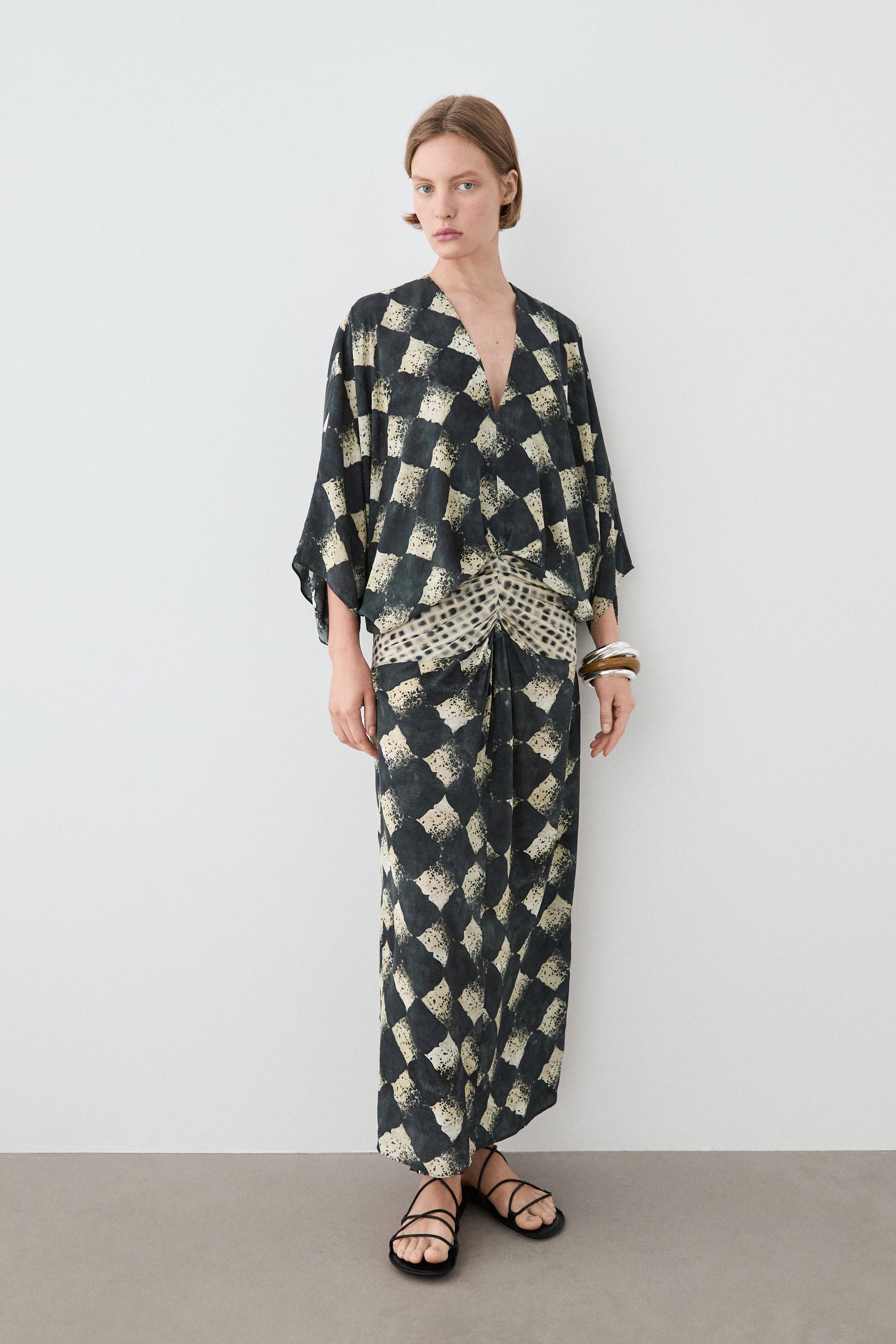 Flowing dress with sash belt detail