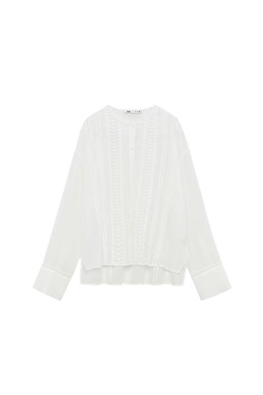ASYMMETRIC HEM BLOUSE