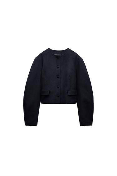 Front view of a black jacket with large buttons and front pockets.