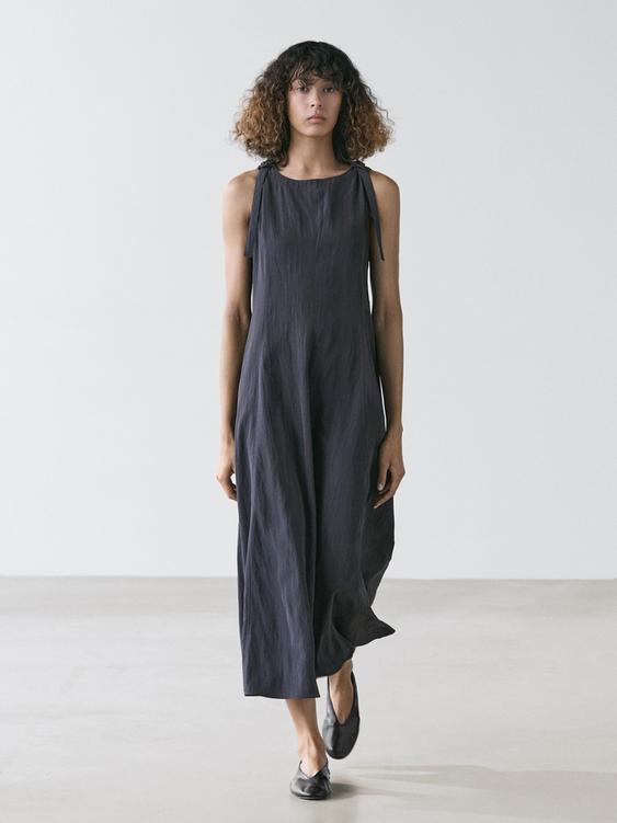 Flowing midi dress with buckles