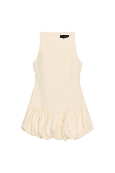 Rear view of butter-coloured, short dress, round neck, sleeveless, bubble hem with elastic and concealed zip at back.