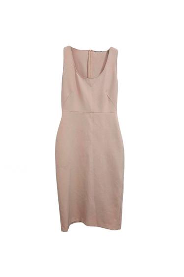 Light beige sleeveless dress, with a round neckline and back fastening. Simple and elegant design on a white background.