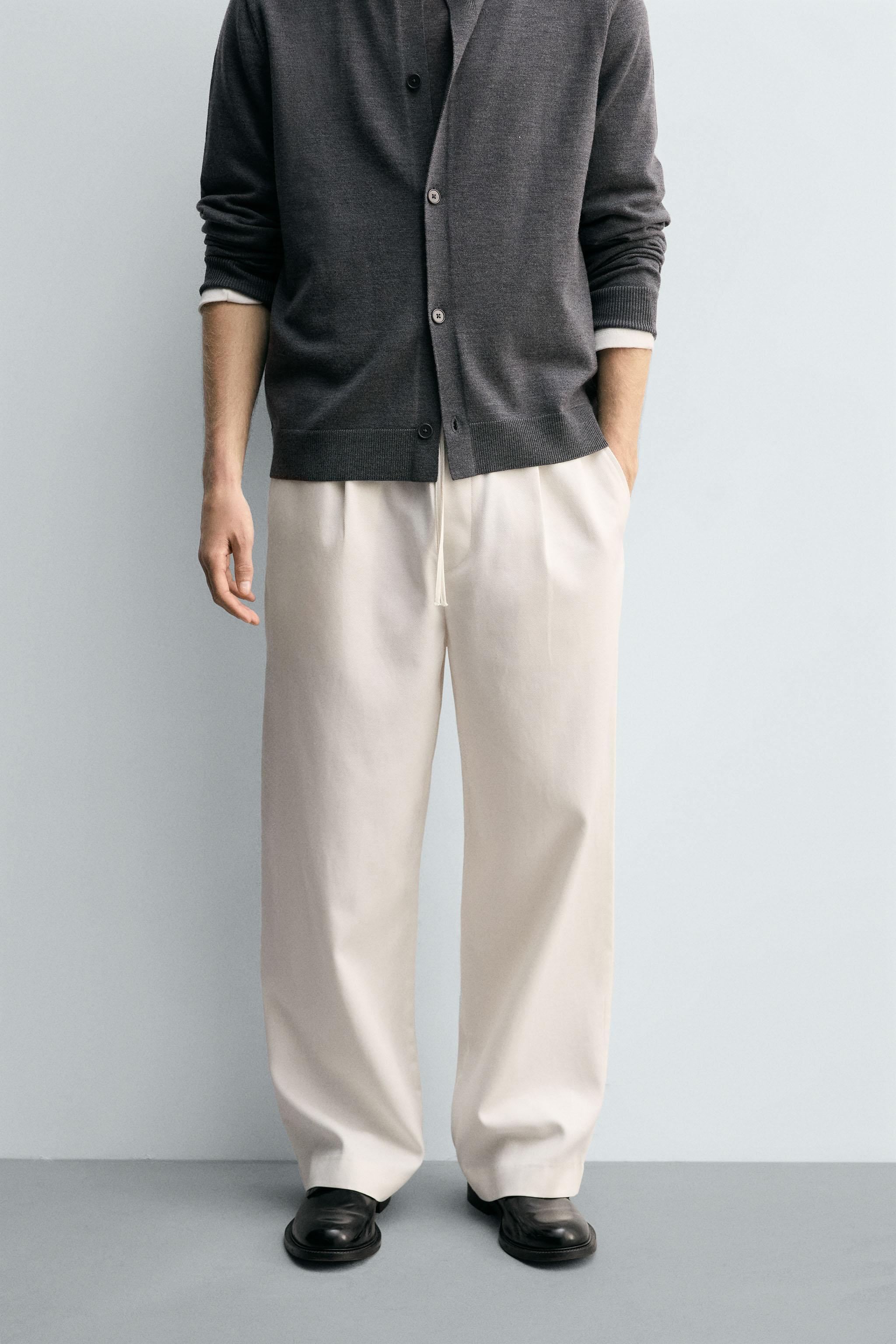 TEXTURED PLEATED PANTS