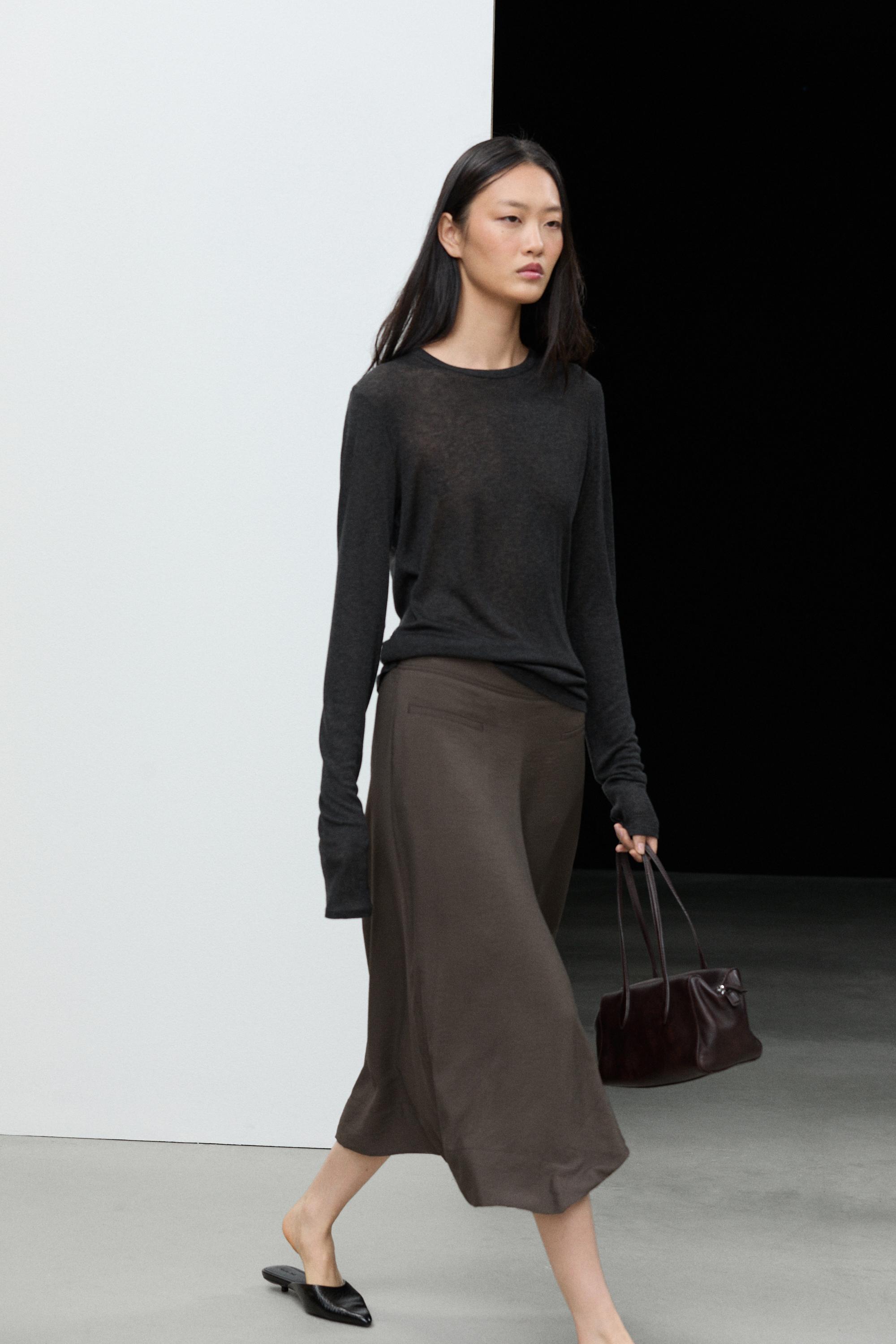 Flowing midi skirt with pleated detail