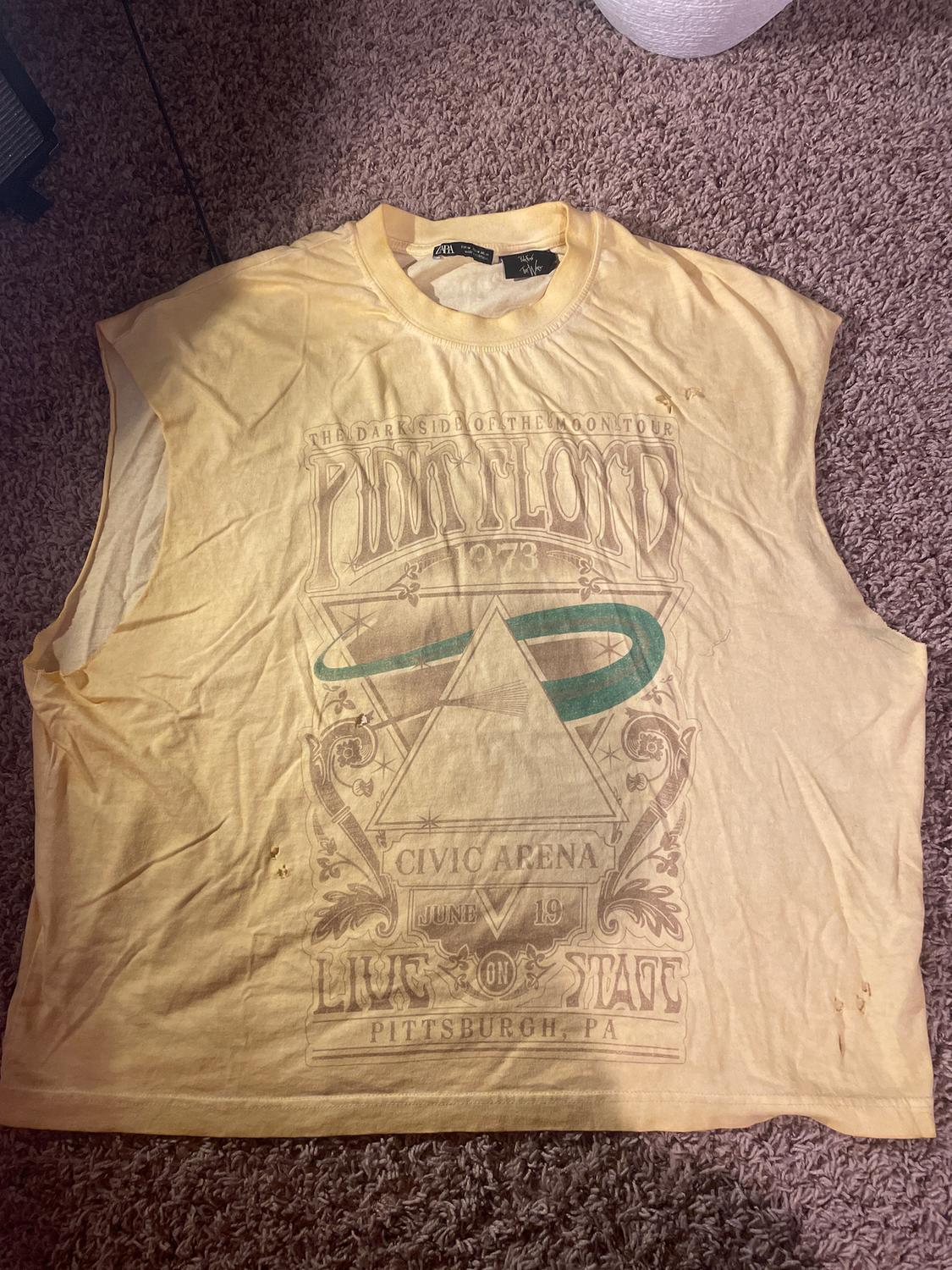 Yellow sleeveless T-shirt with Pink Floyd 1973 concert graphic design, text "Civic Arena June 19 Live on Stage Pittsburgh PA".