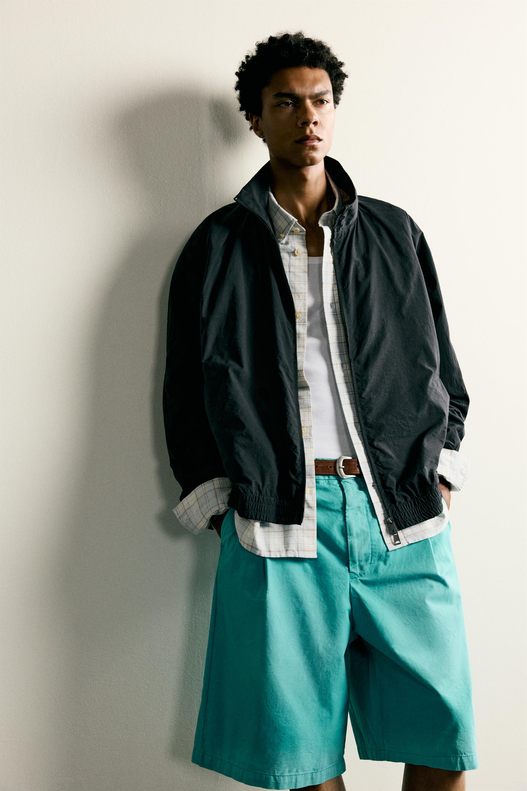 WASHED PLEATED RELAXED FIT SHORTS