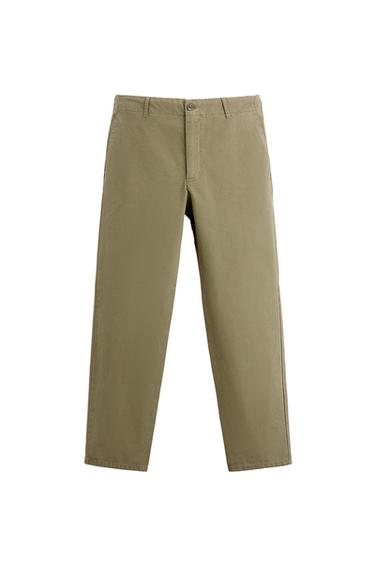 Front view of khaki trousers with side pockets and belt loops.