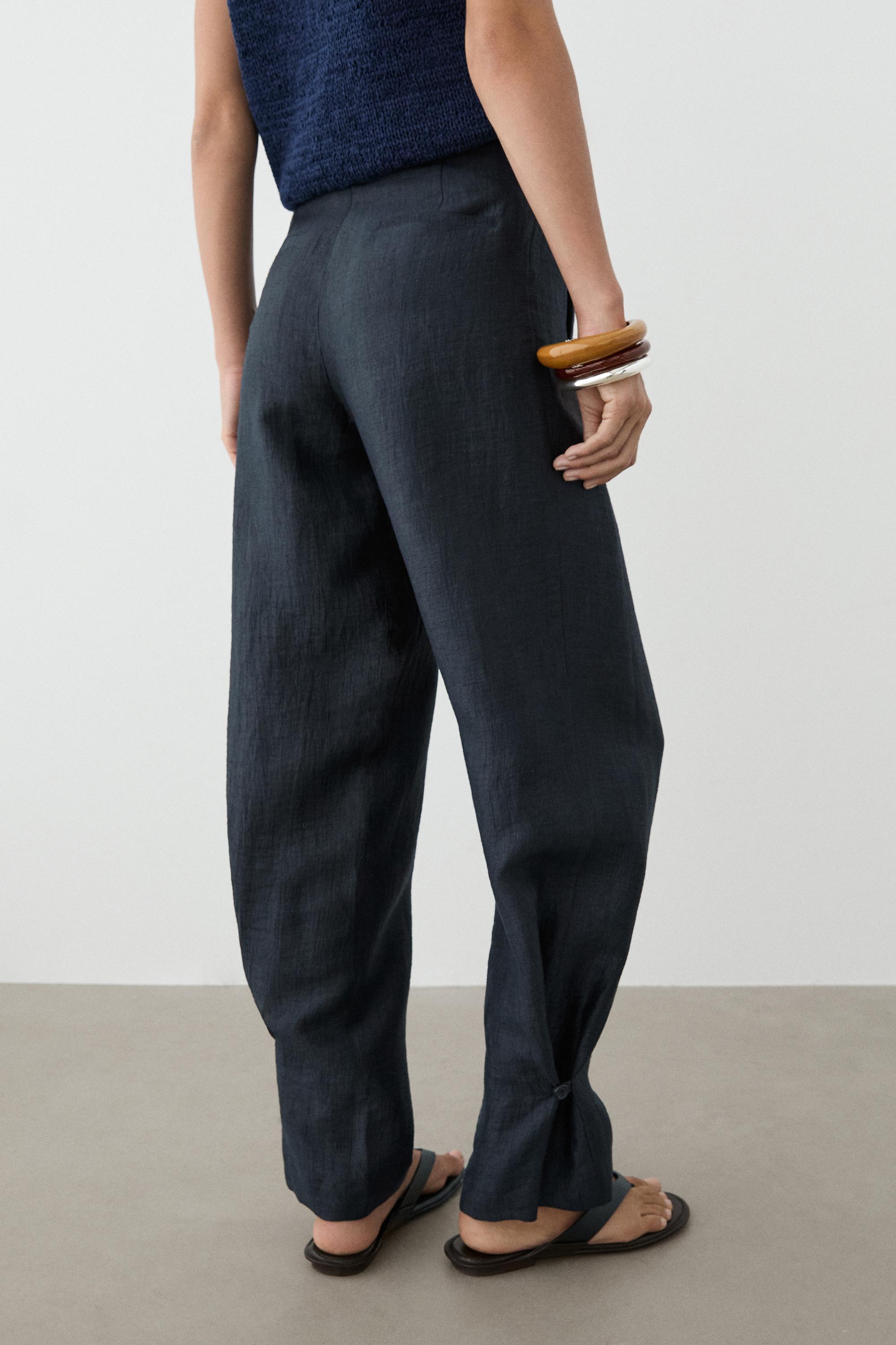 Trousers with gathered hems