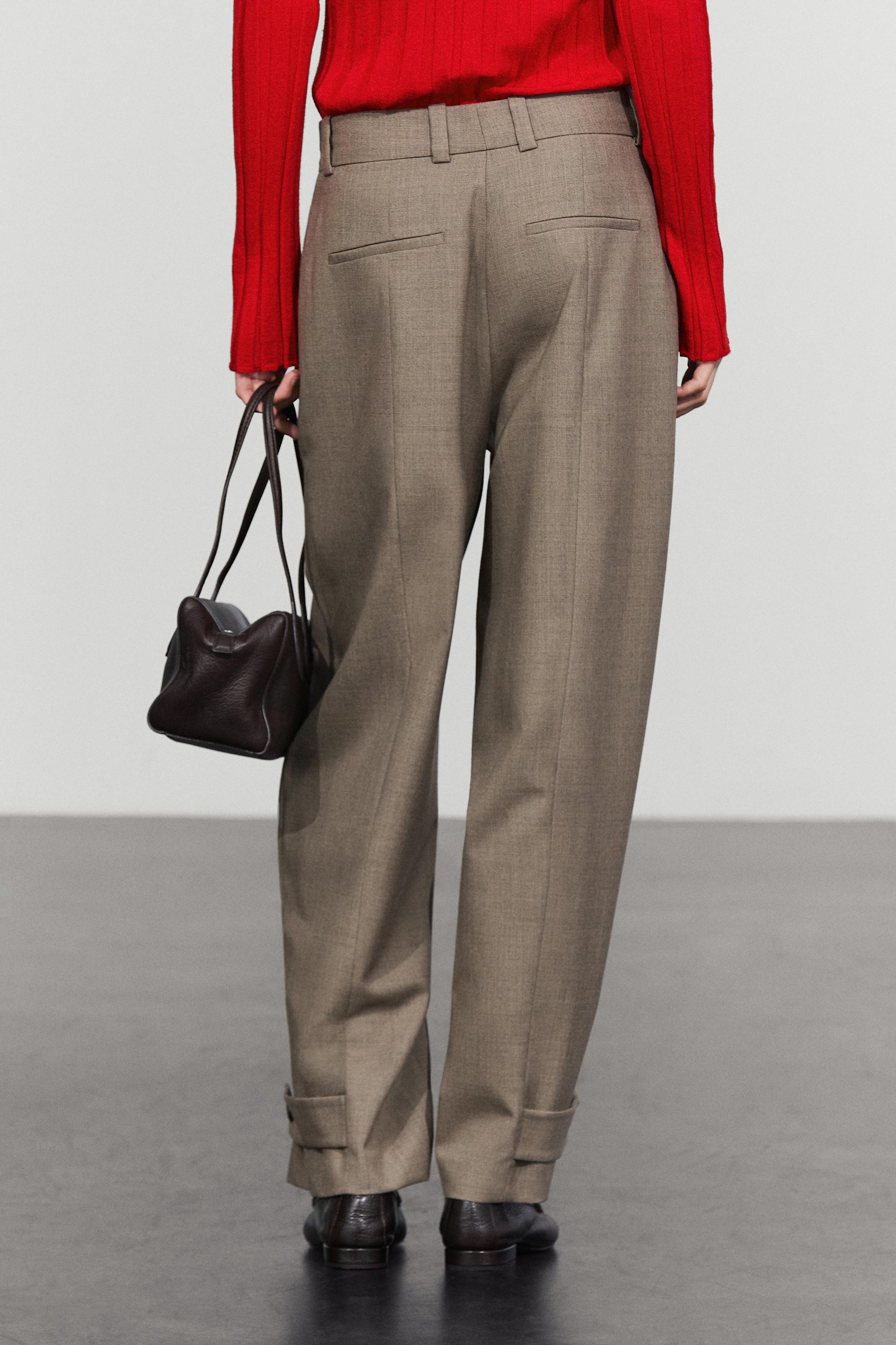100% wool darted pants with buttoned hem detail