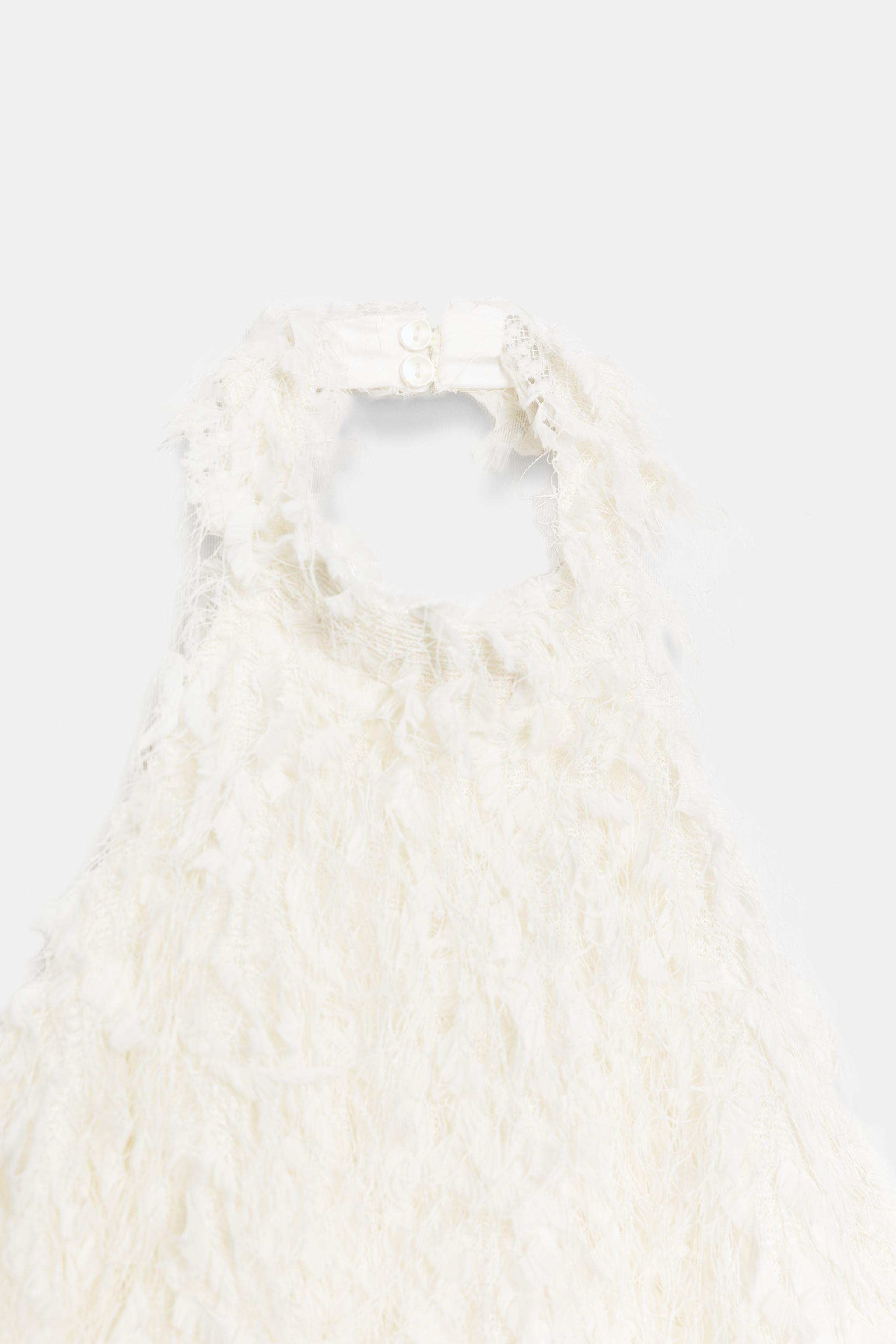 ROBE COURTE EN MAILLE À FRANGES