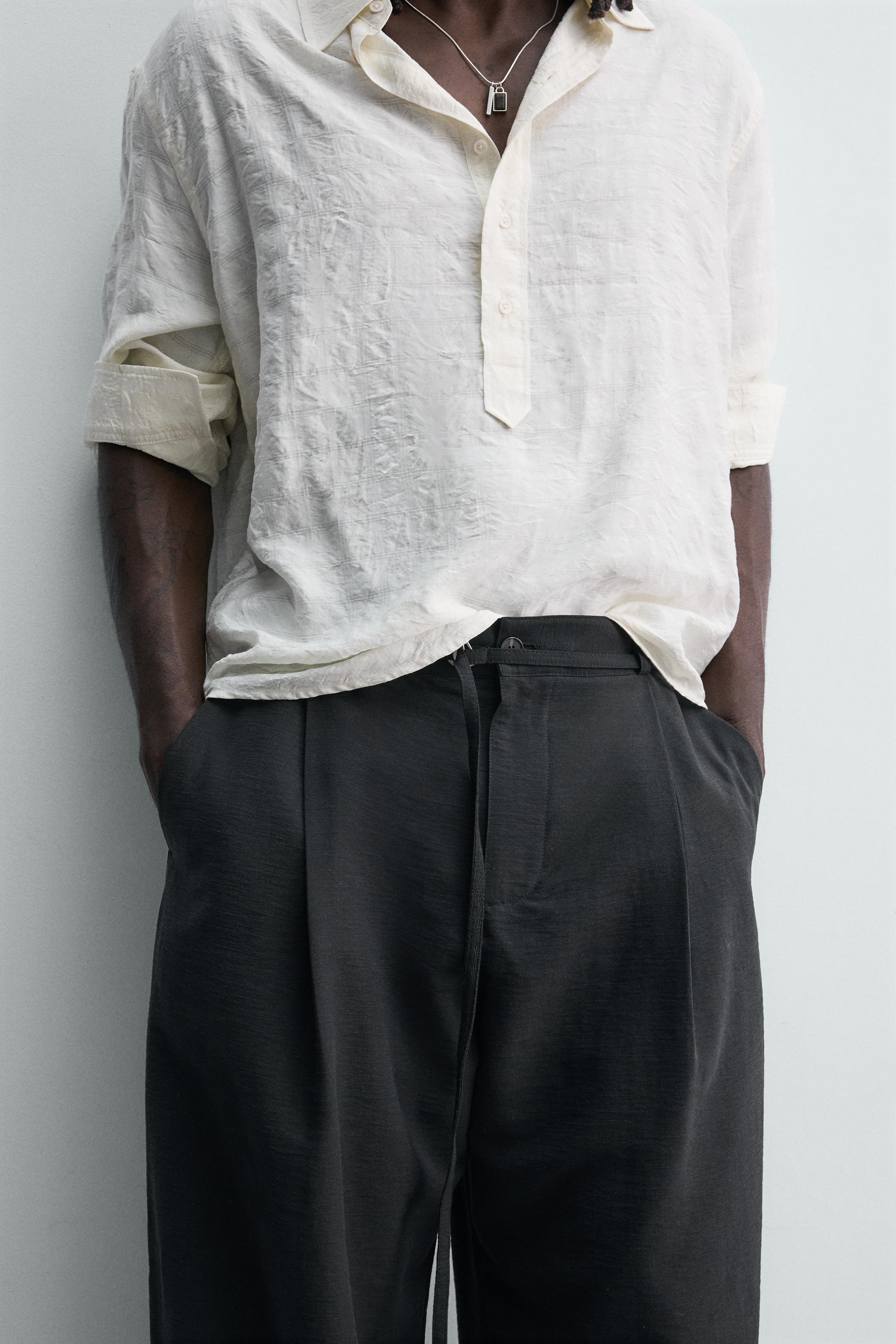 BALLOON FIT PLEATED BELTED PANTS