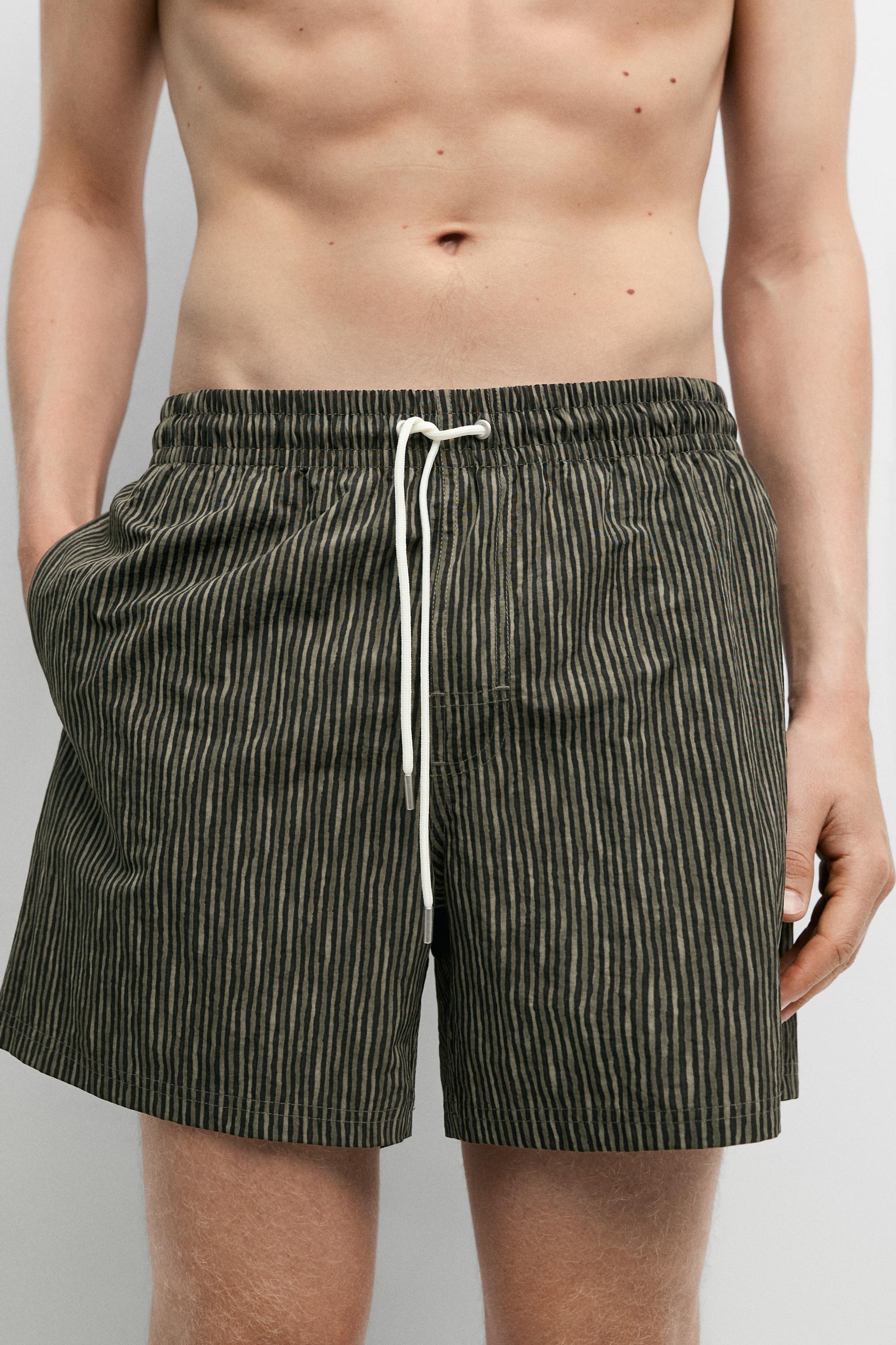Striped print swimming trunks