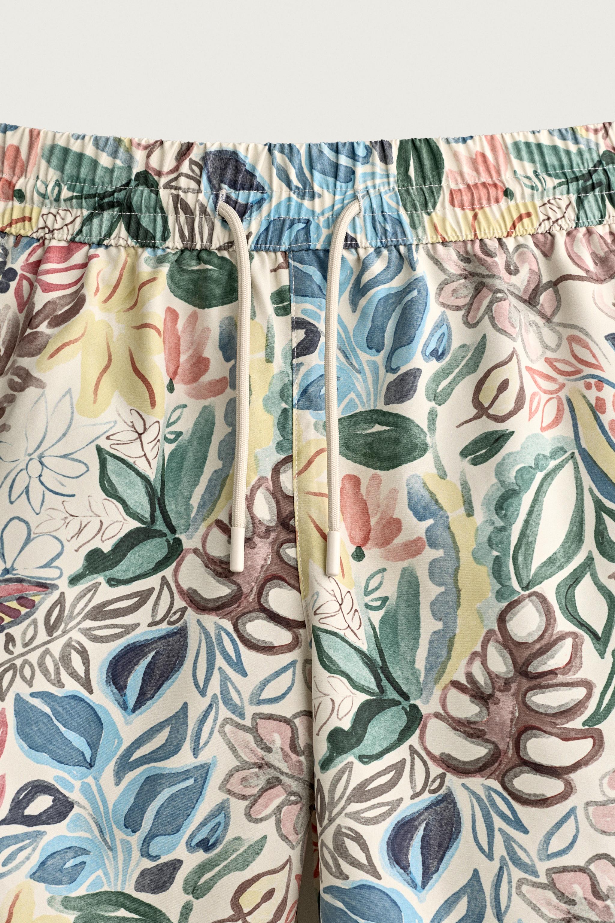 LONG FLORAL PRINT SWIM TRUNKS